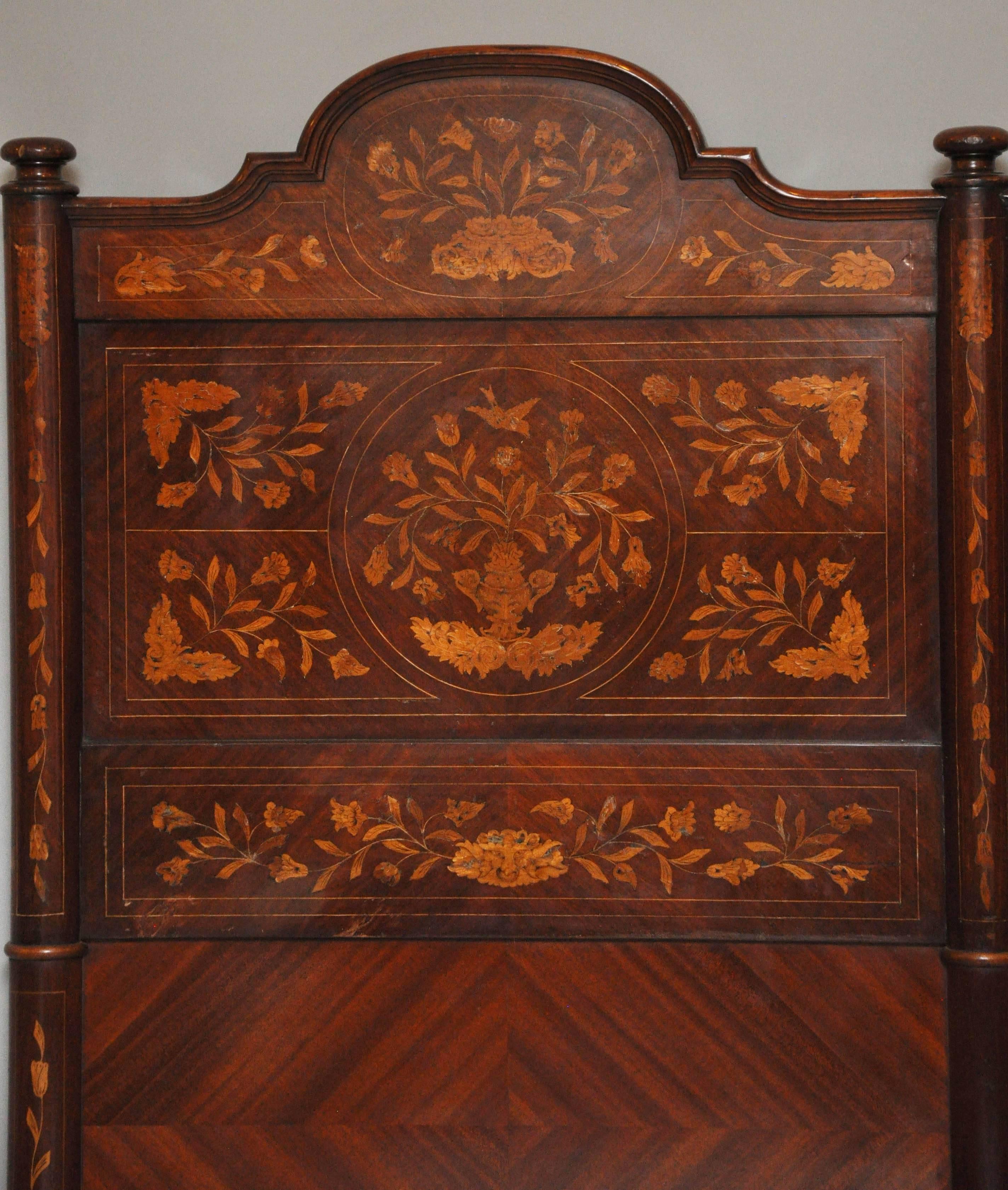 Dutch marquetry king-size bed, converted from a pair of single 18th century single beds. Headboard with diamond shaped parquetry pattern panels beneath geometric, floral and foliate marquetry surmounted by a shapely crown, footboard with floral