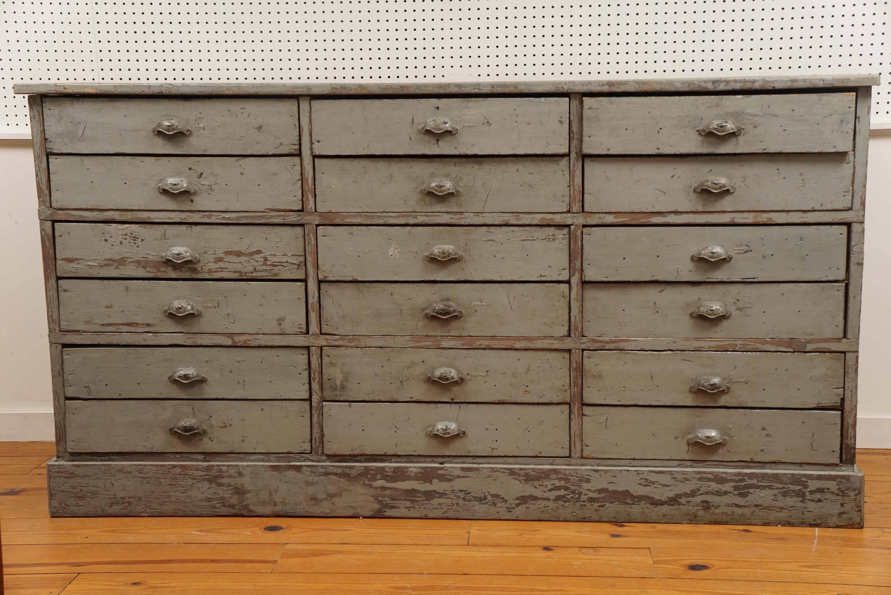 This worn, original painted dresser base has a soft grey color and metal pulls which are also original. It’s clear that we, at Painted Porch are addicted to multi drawer pieces, particularly if they are useful and this piece certainly is. It is a