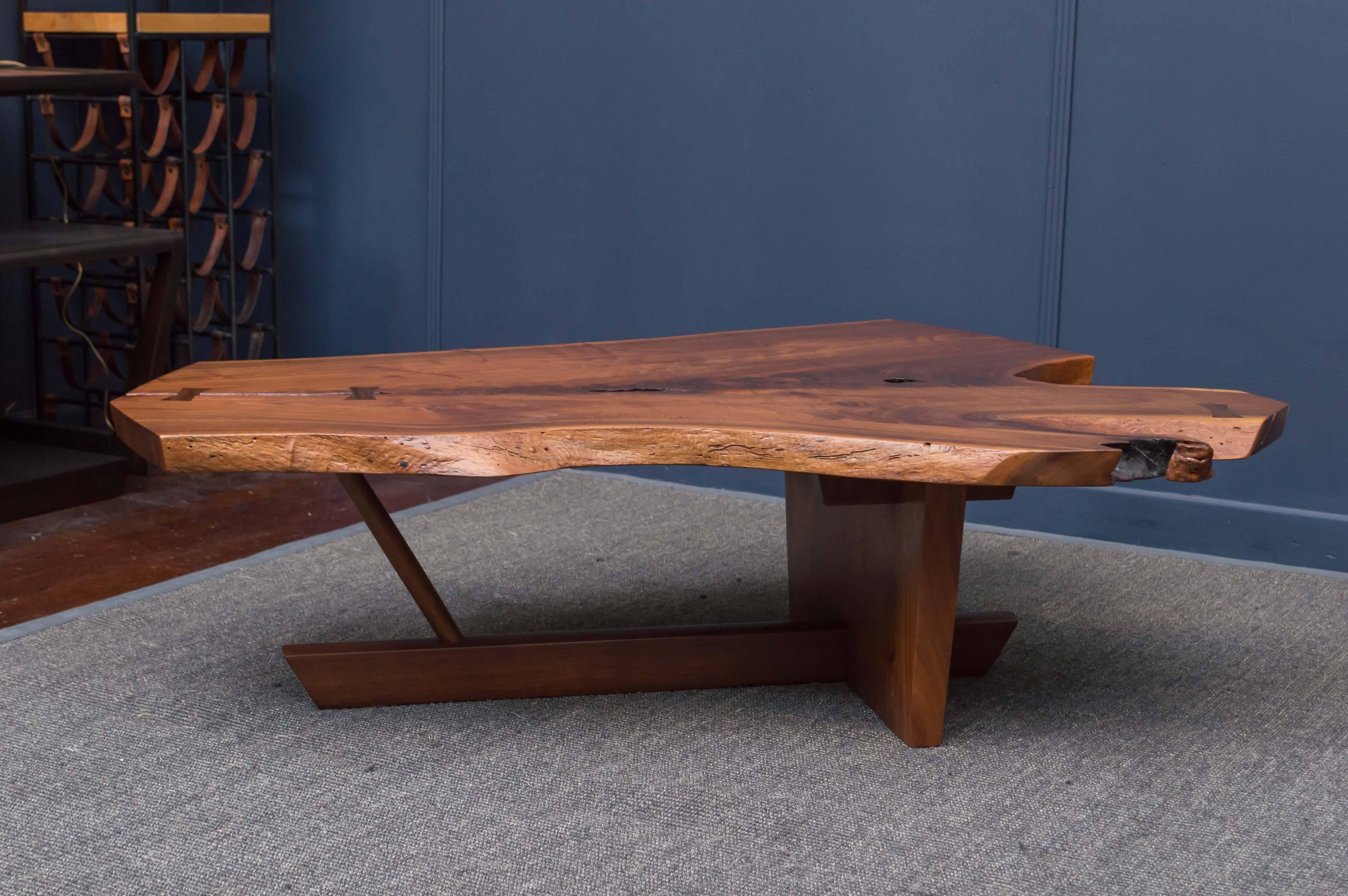 Expressive design in highly figured walnut with fissures and rosewood butterfly joinery. 
Custom ordered by the original owner from Mira Nakashima, signed and dated.
Exceptional example in pristine condition.