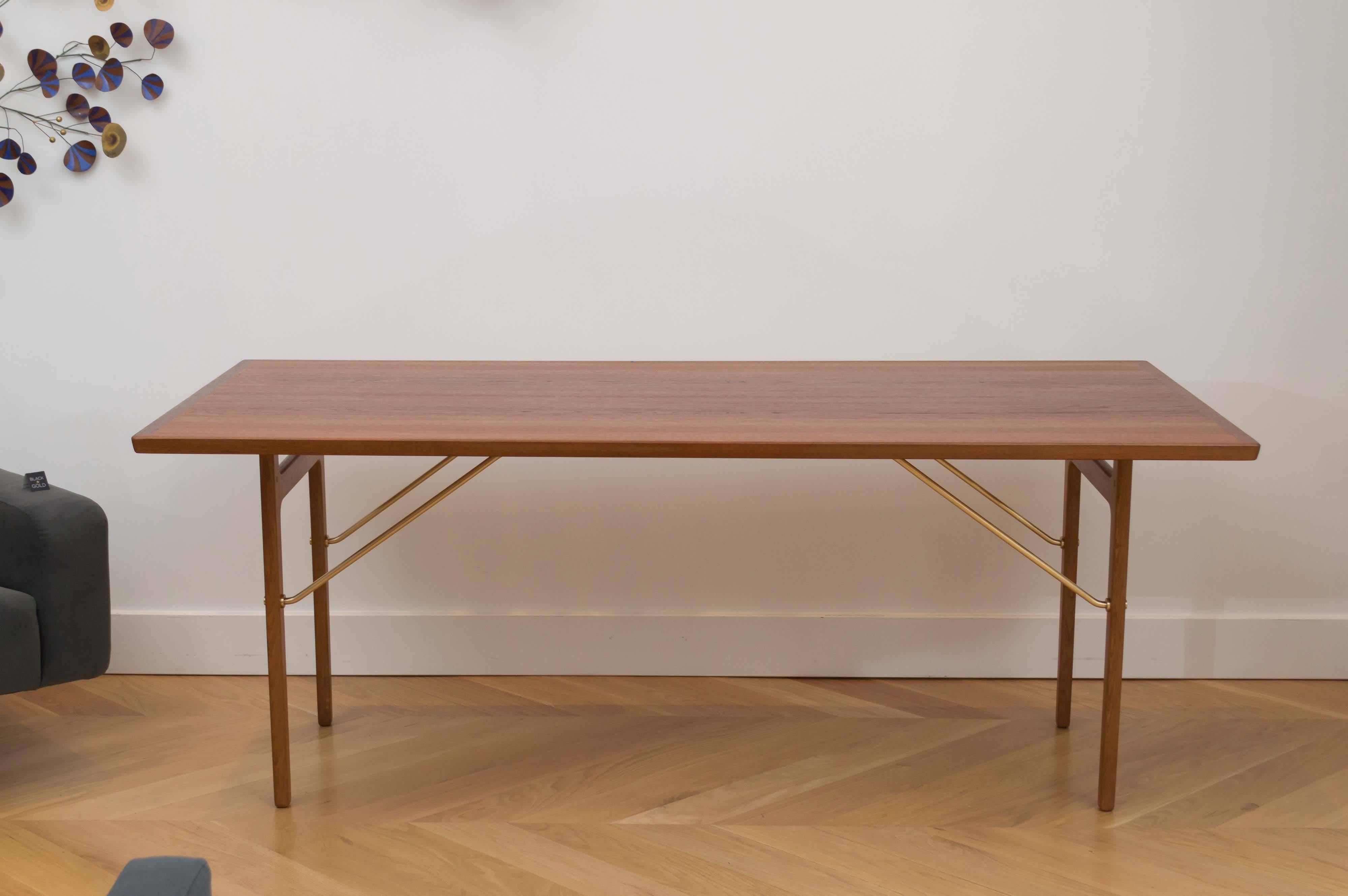 Danish teak work with polished brass hardware by Torben Strandgaard.