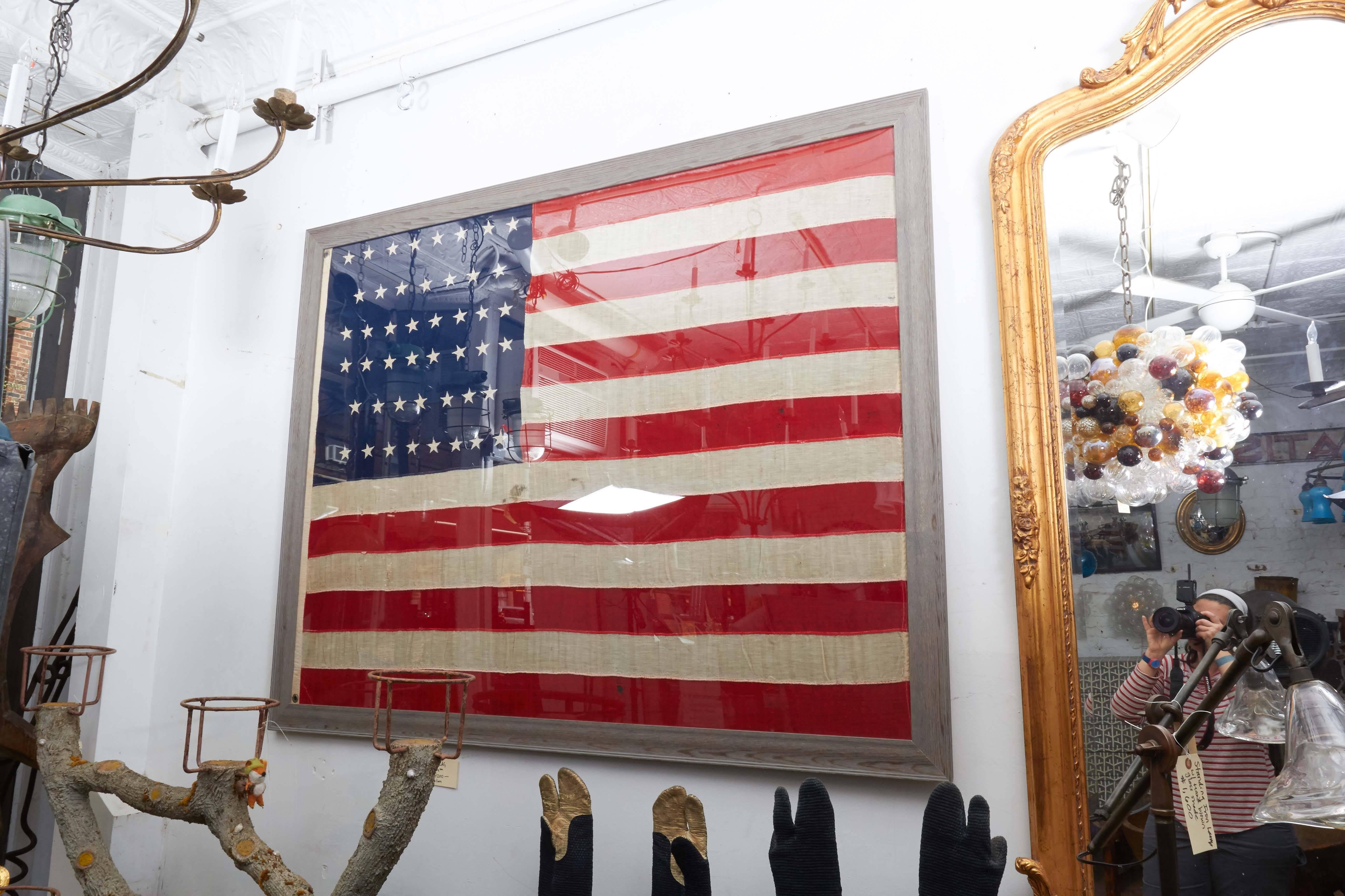 1896 American flag, 45 stars on linen, hand appliqued, mounted inside frame.
