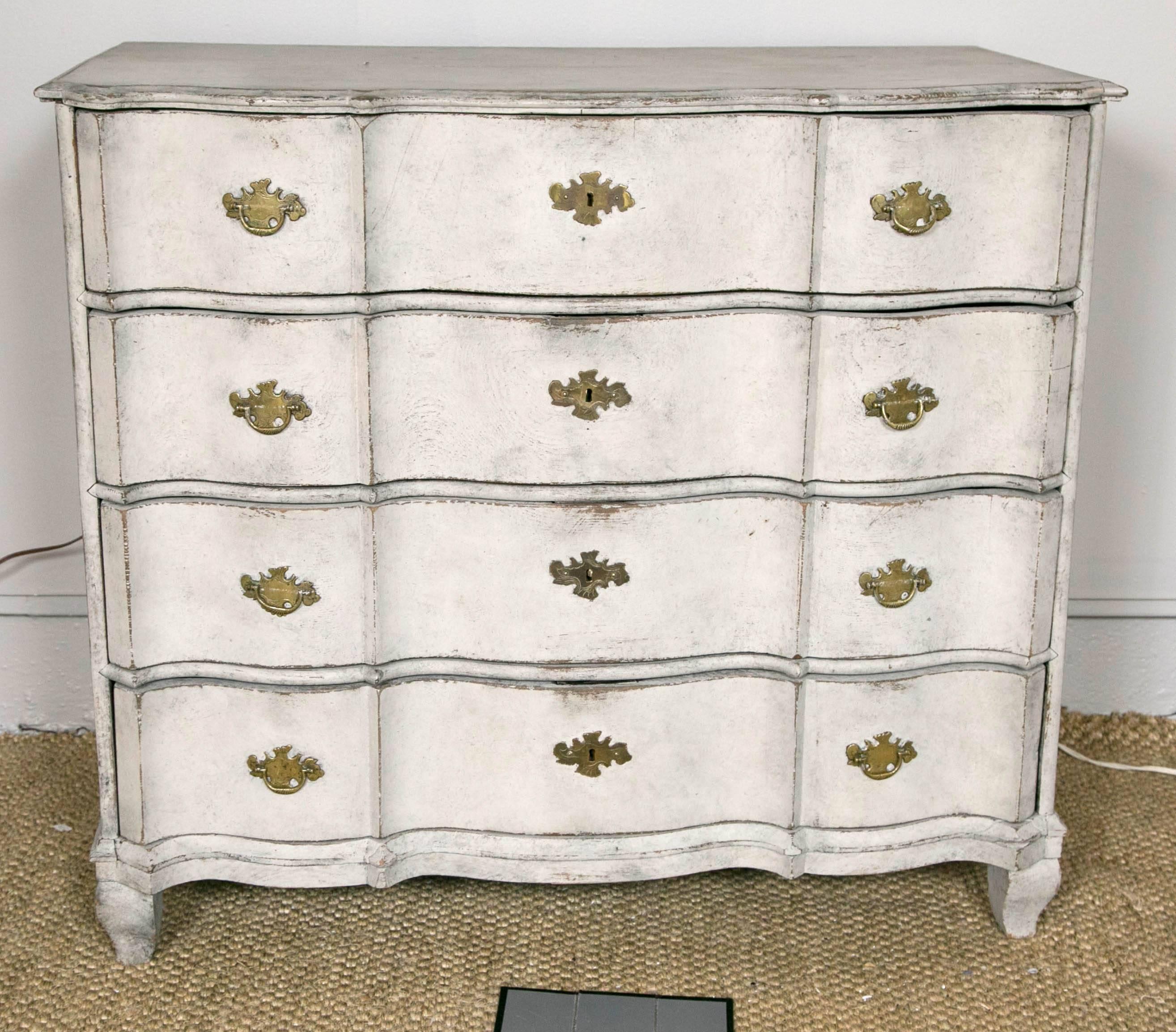 Antique Swedish chest with unusual triple serpentine front. Four large drawers with dovetail joiners. Brass hardware on each drawer and on each side. Original first paint in Swedish gray.