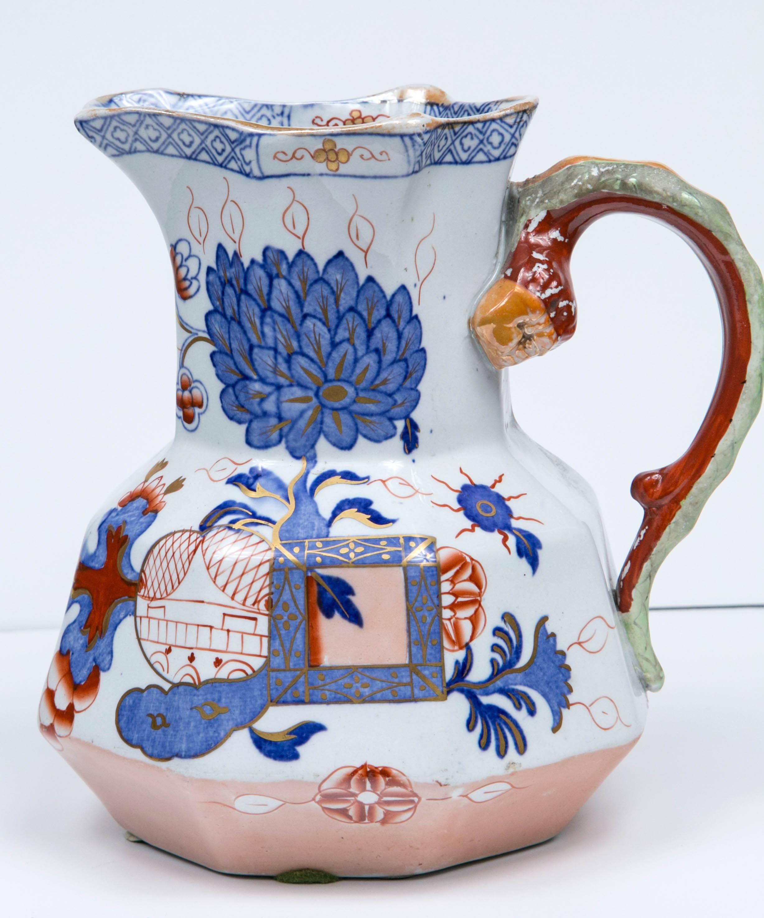 Jug by Mason's Ironstone with an octagonal shape and handle. The red and blue oriental pattern features gold leaf details.