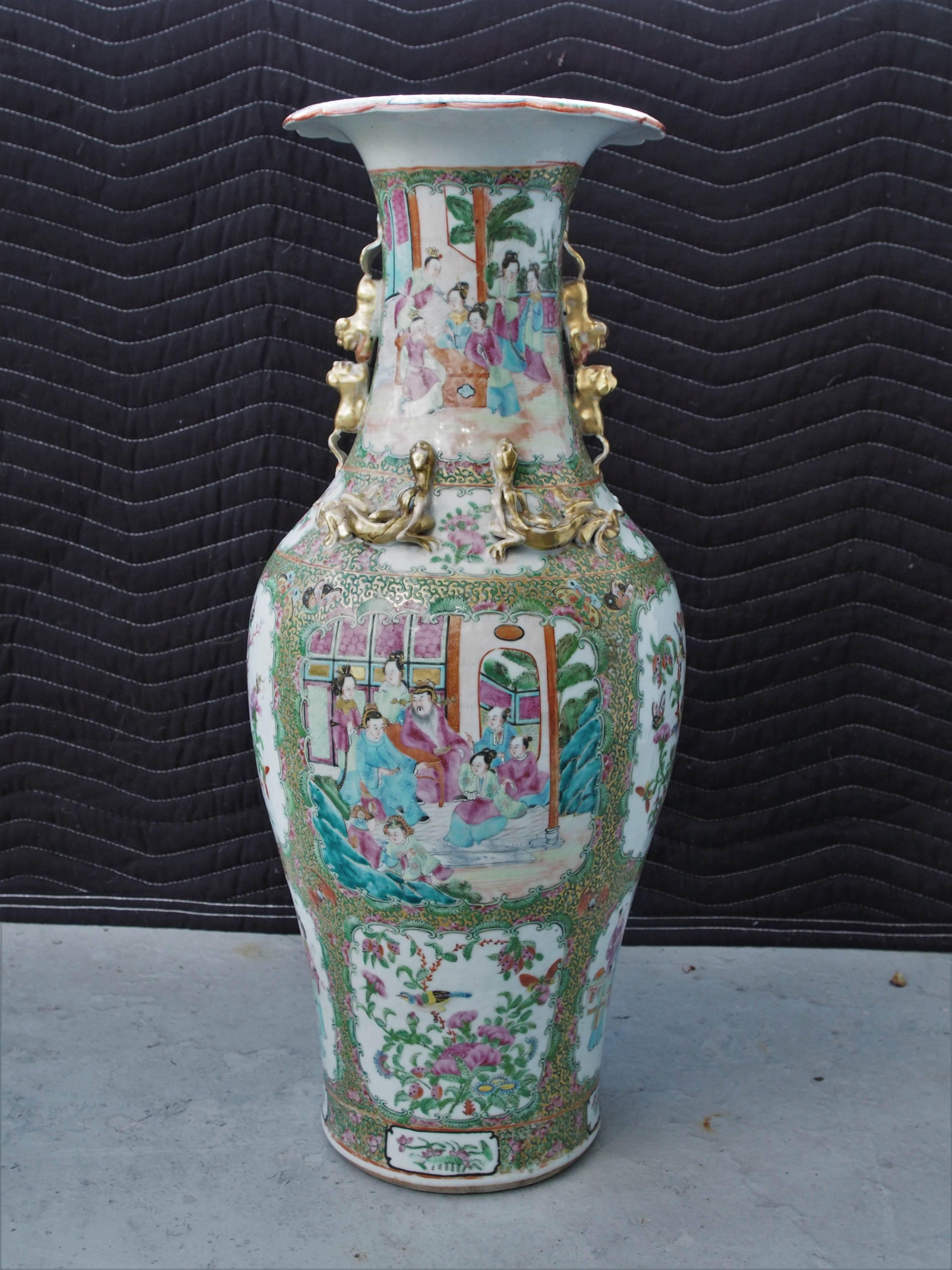 Large pair of famille rose vases with foo dog handles.
 