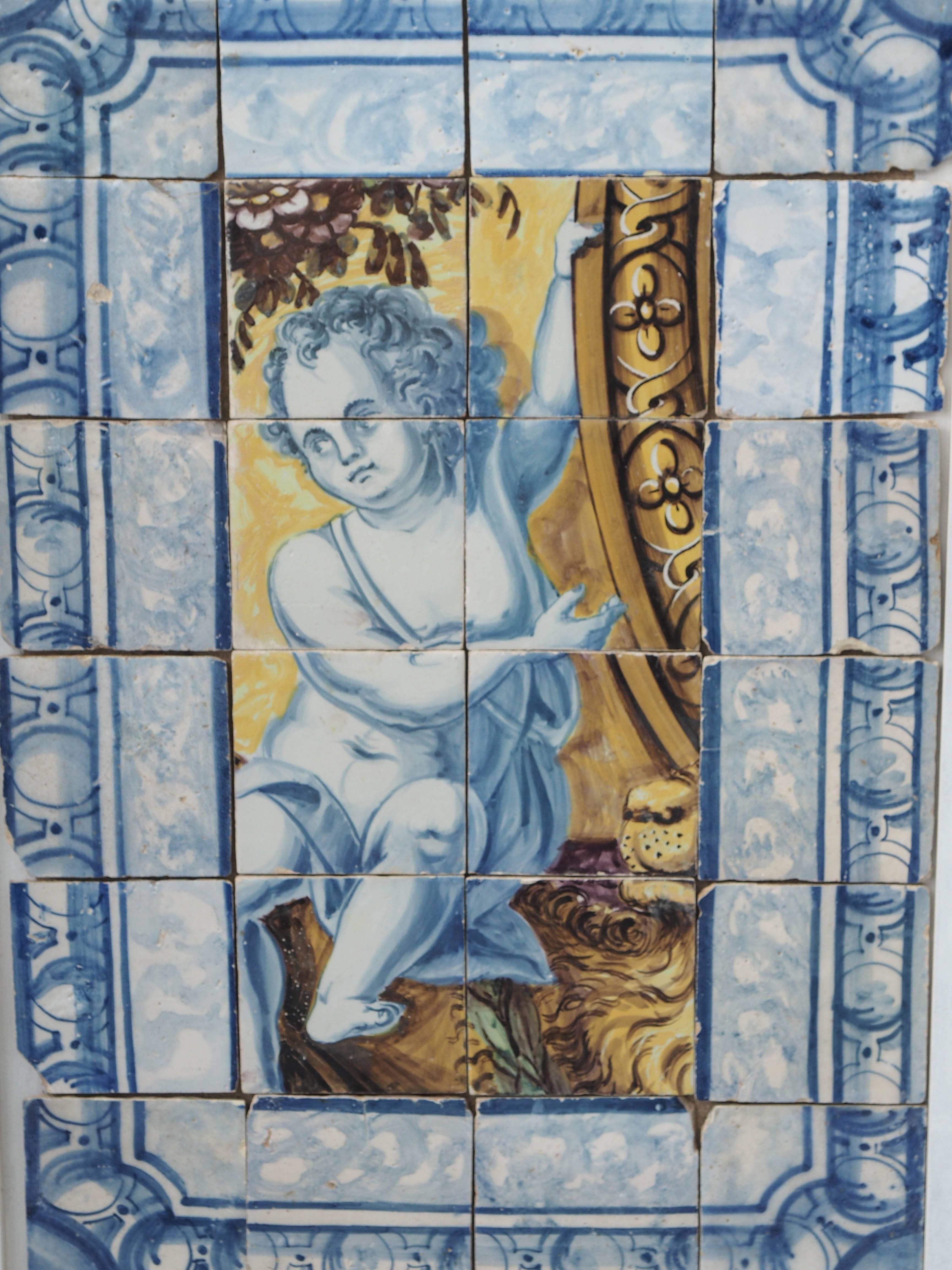Three 18th century Portuguese tile panels with borderland central scenes of putto.
