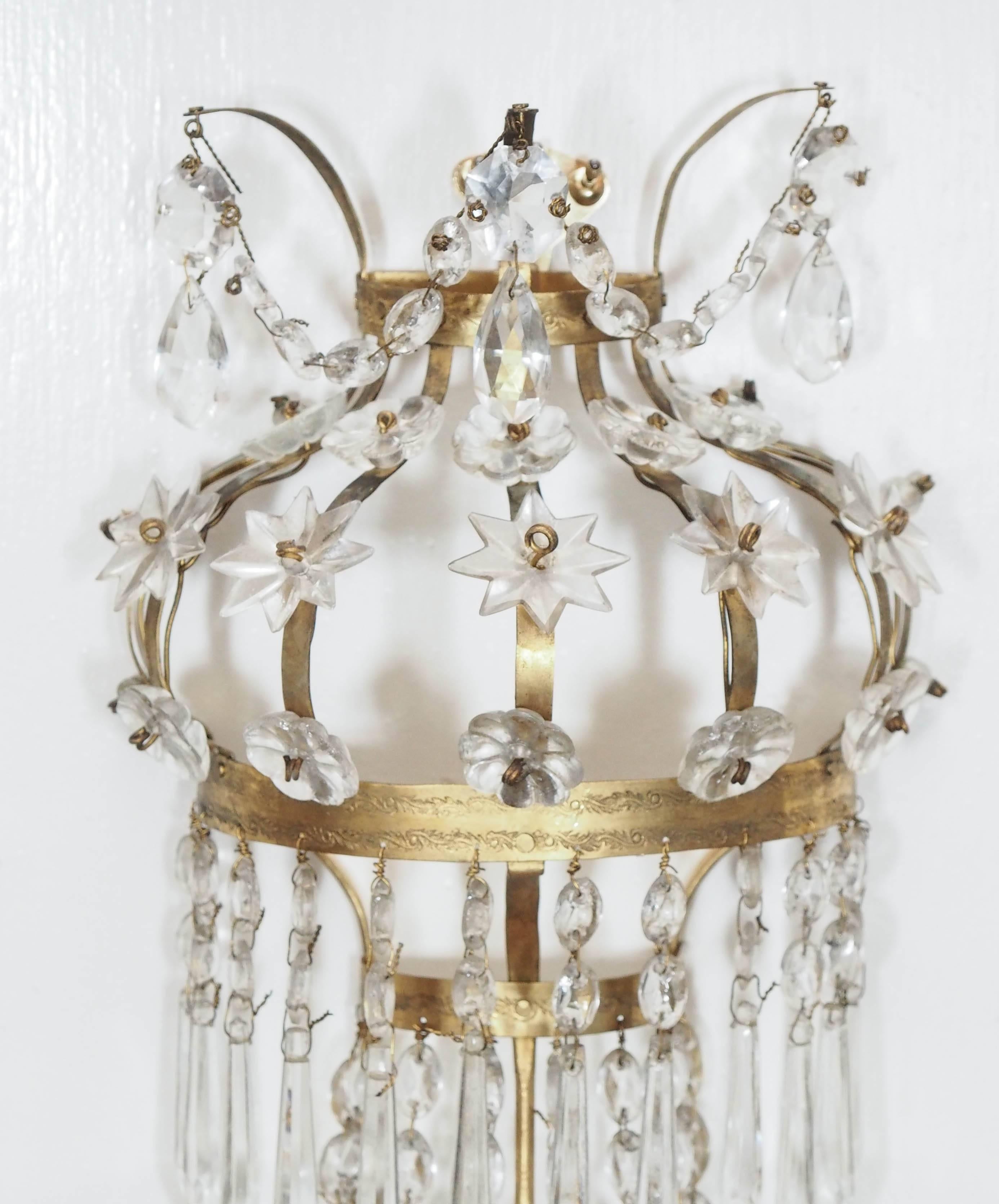 Pair of three-arm Italian Empire style brass and crystal wall sconces.
