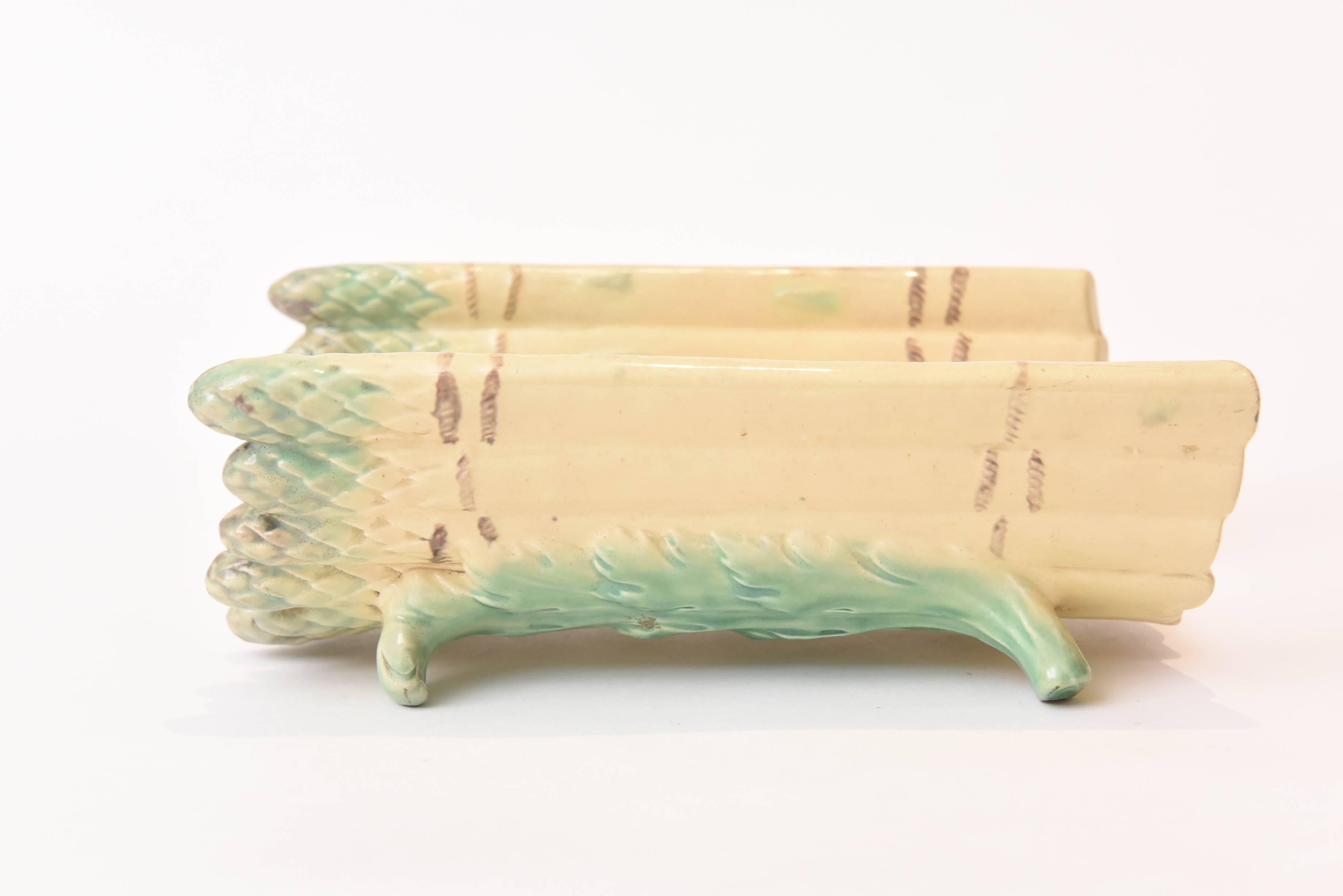A charming French hand-painted Majolica asparagus server with realistic colors and nicely detailed molding. Perfect for display or for serving. We cannot find a hallmark but attribute to one of the French factories of the last quarter 19th century.
