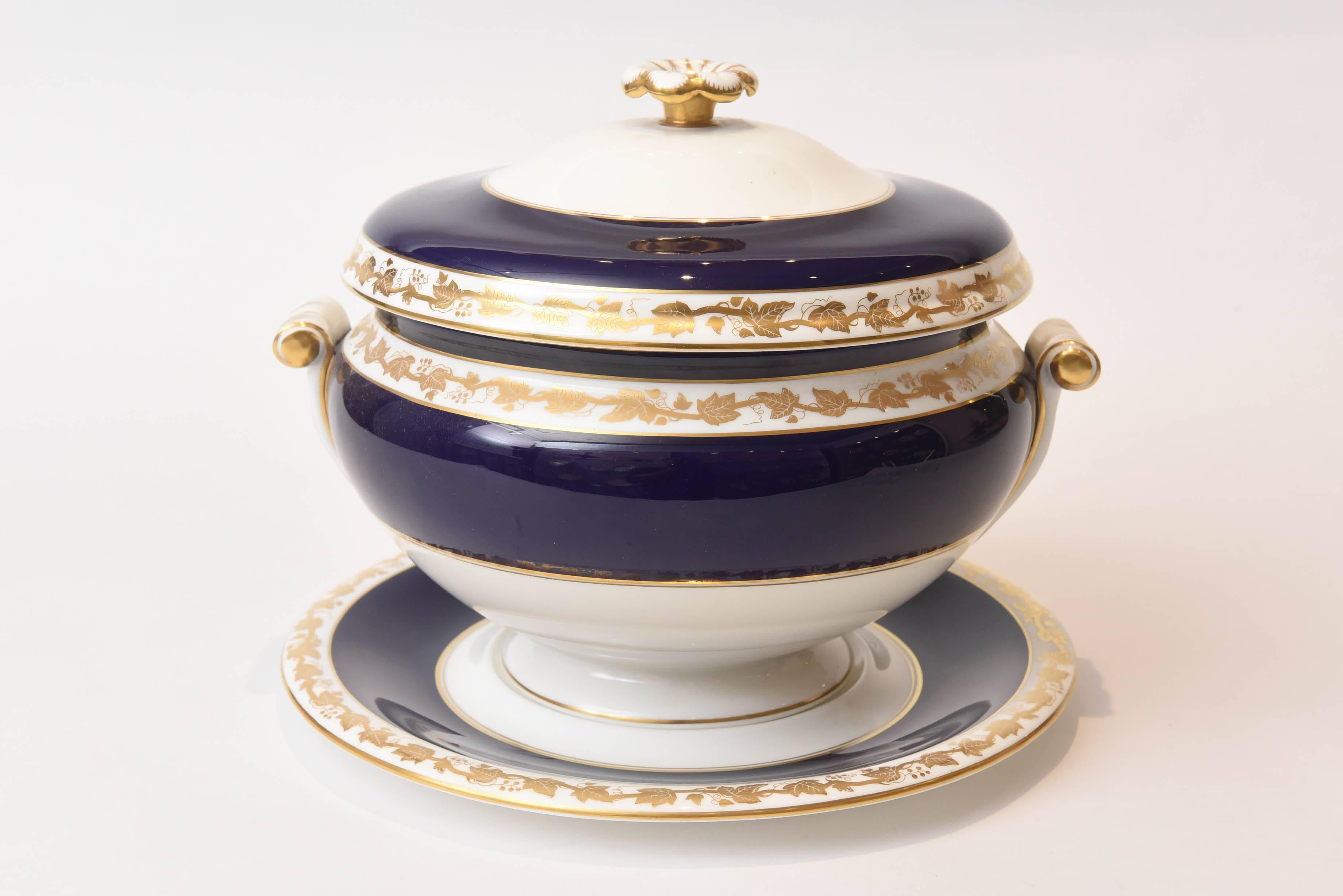 A Classic pattern by Wedgwood, England in super vintage condition. Wonderful pedestal base on a fitted undertray with a delightful finial top and handles. Trimmed and highlighted in 24-karat gold on a cobalt blue ground. A rare and hard to find