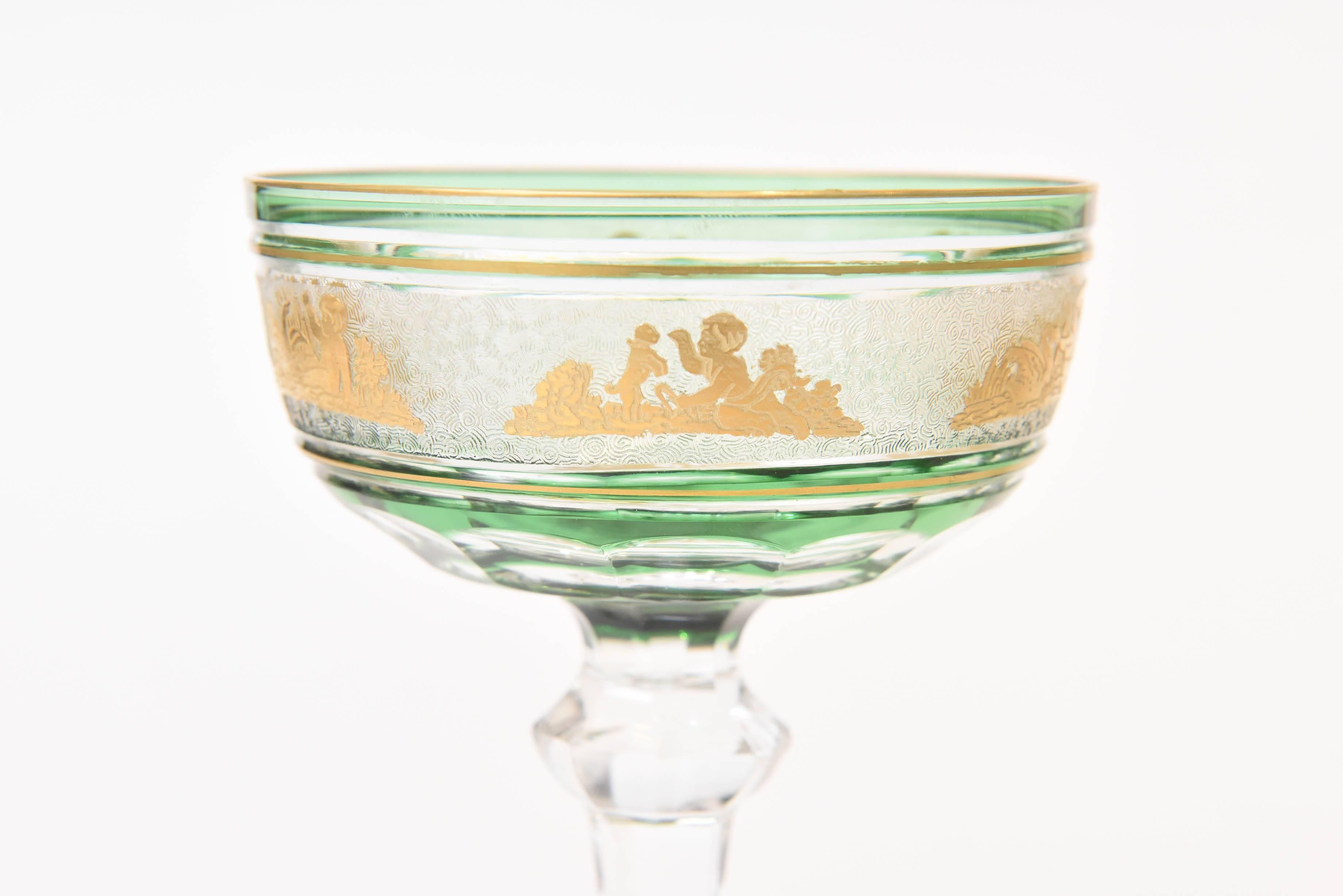 A stunning and hard to find pattern from the great crystal house of Val Saint Lambert, Belgium. A heavily free blown glass which has added emerald green casing and features delightful gilded cameo figures on an acid etched background. A perfectly