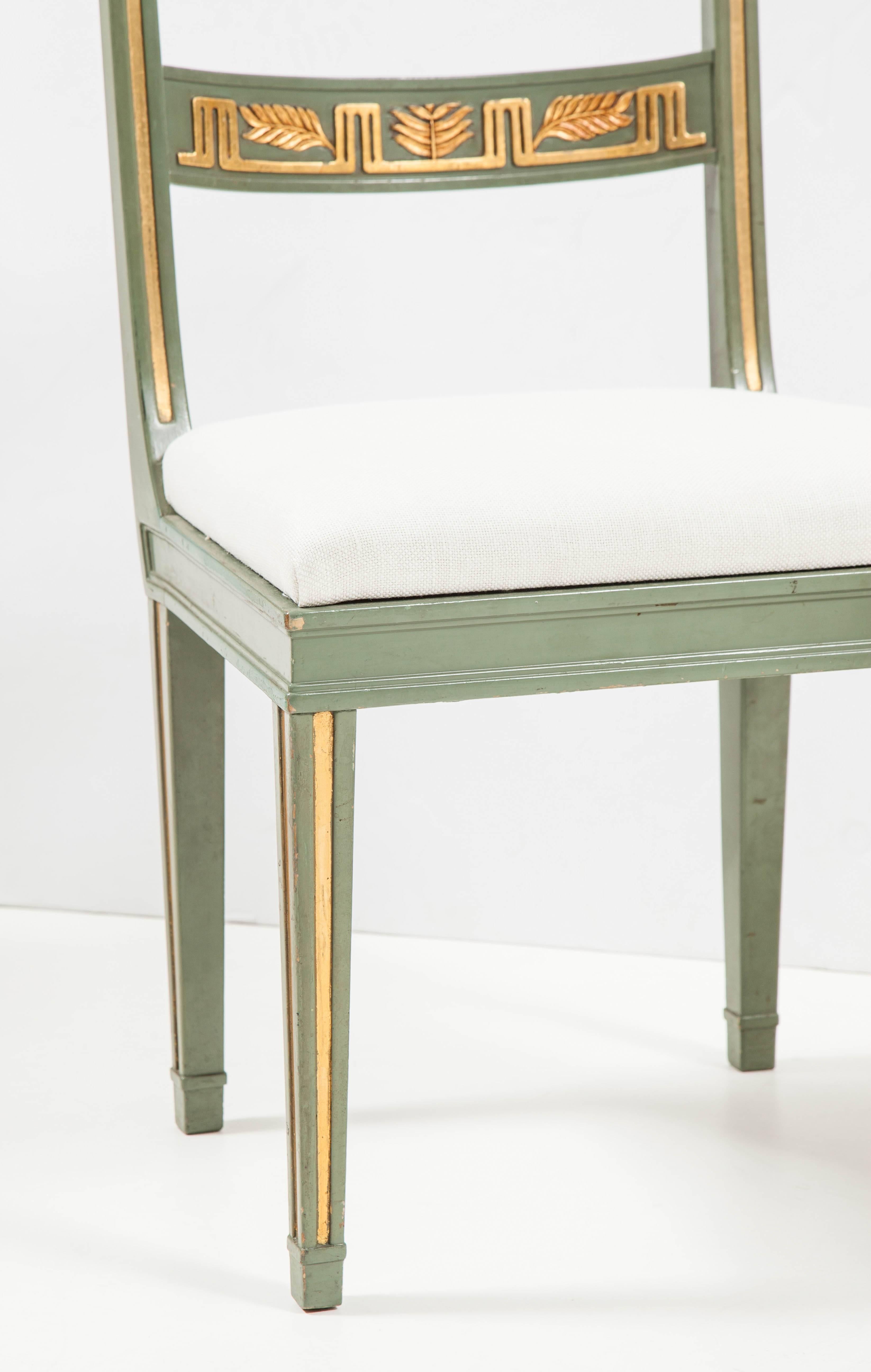 A pair of Carl Malmsten painted and parcel-gilt side chairs, circa 1930-1940. These chairs were commissioned by the Danish interior designer Svend Thoresen whilst working at the famous Swedish furniture store Nordiska Kompaniet for an apartment in