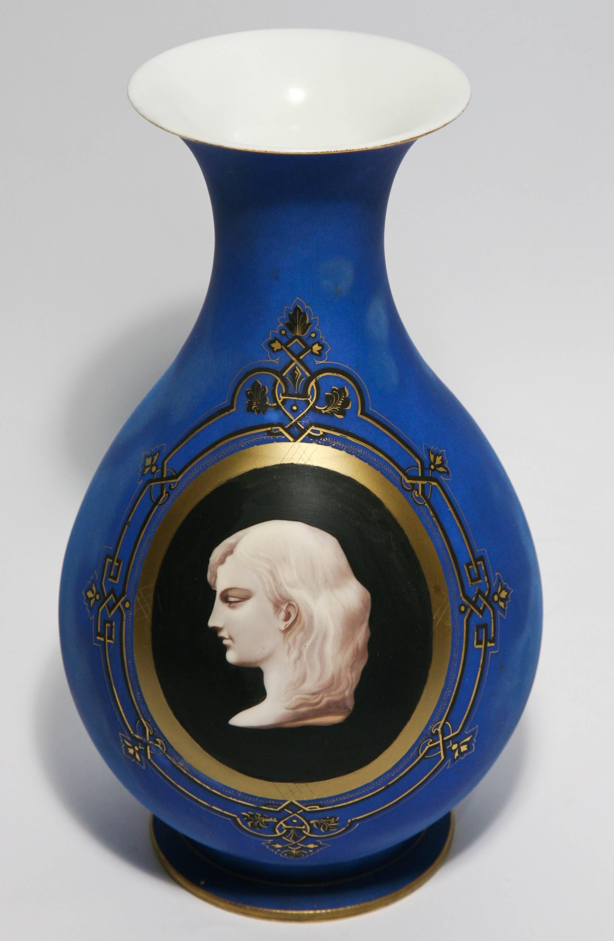 A unique and well done portrait vase on an allover royal blue ground with gilt accents. An interesting black ground where the neoclassical portrait is painted on. We attribute the maker to one of the English Bristol glass factories and circa 1850.