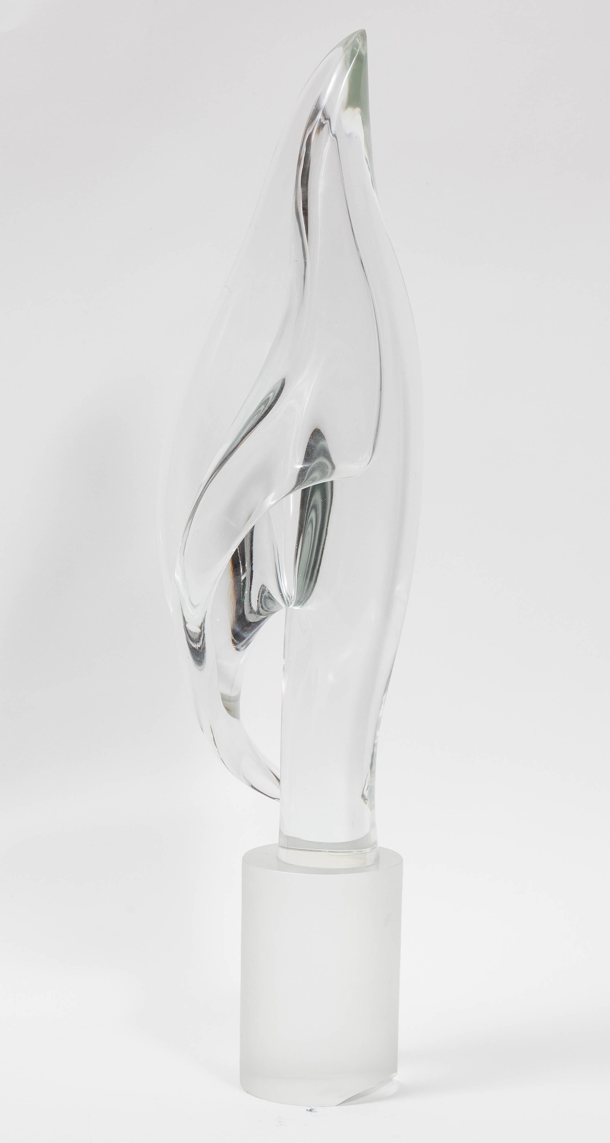 This graceful work consists of a clear glass flame-like design on a cylindrical frosted glass base. The piece has an ethereal quality about it, and can add star power to a room without taking up too much air space. Signed Livio Seguso.