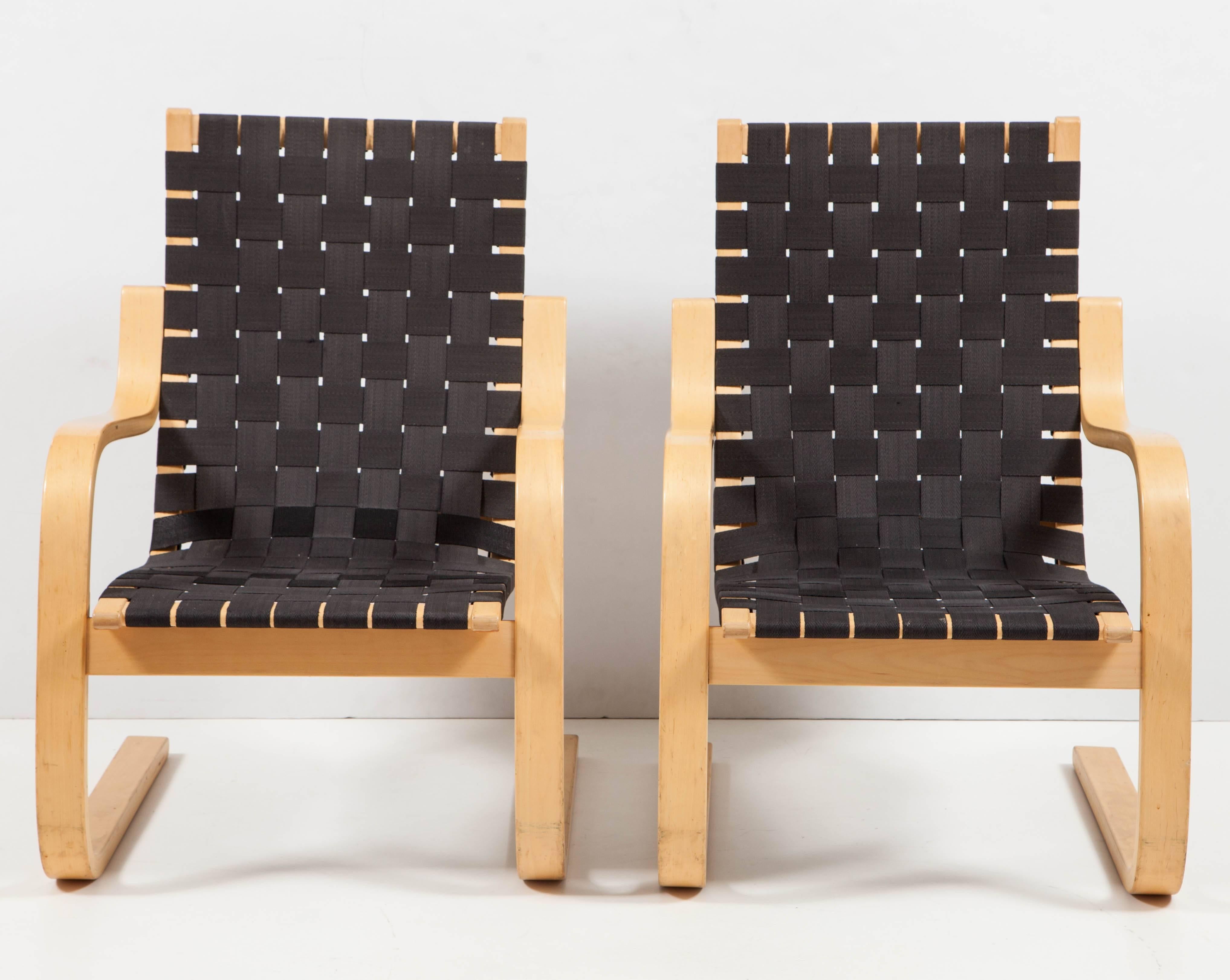 Pair of chairs in birch and black webbing designed by Alvar Aalto and manufactured in Finland in the late 1960s.
The chairs have been refinished and are in perfect condition.