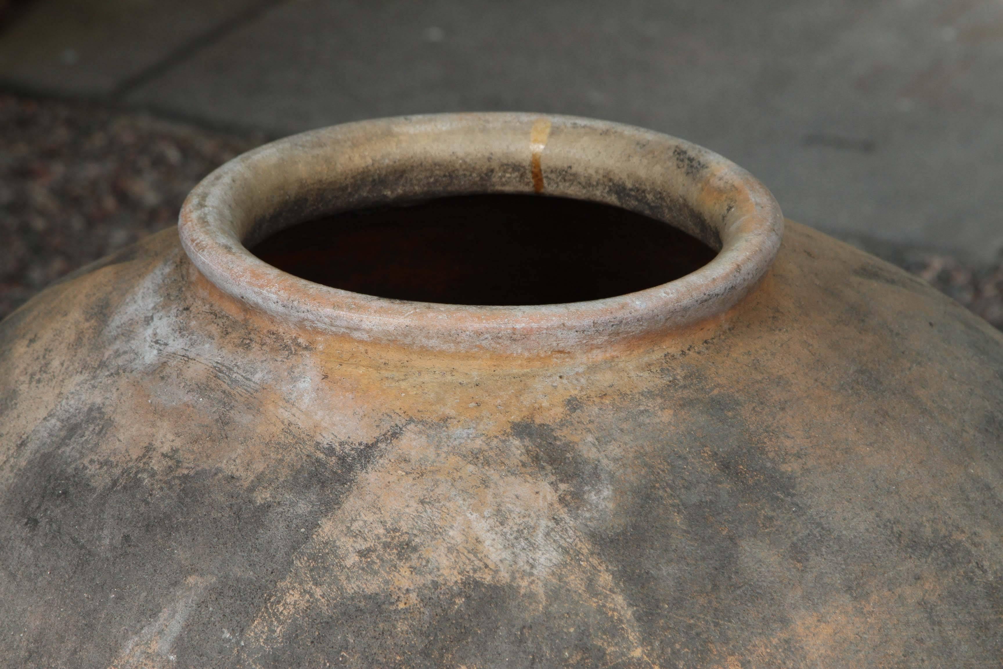 A large 19th century terra cotta pot with nice form and great patina, from Oaxaca, Mexico.