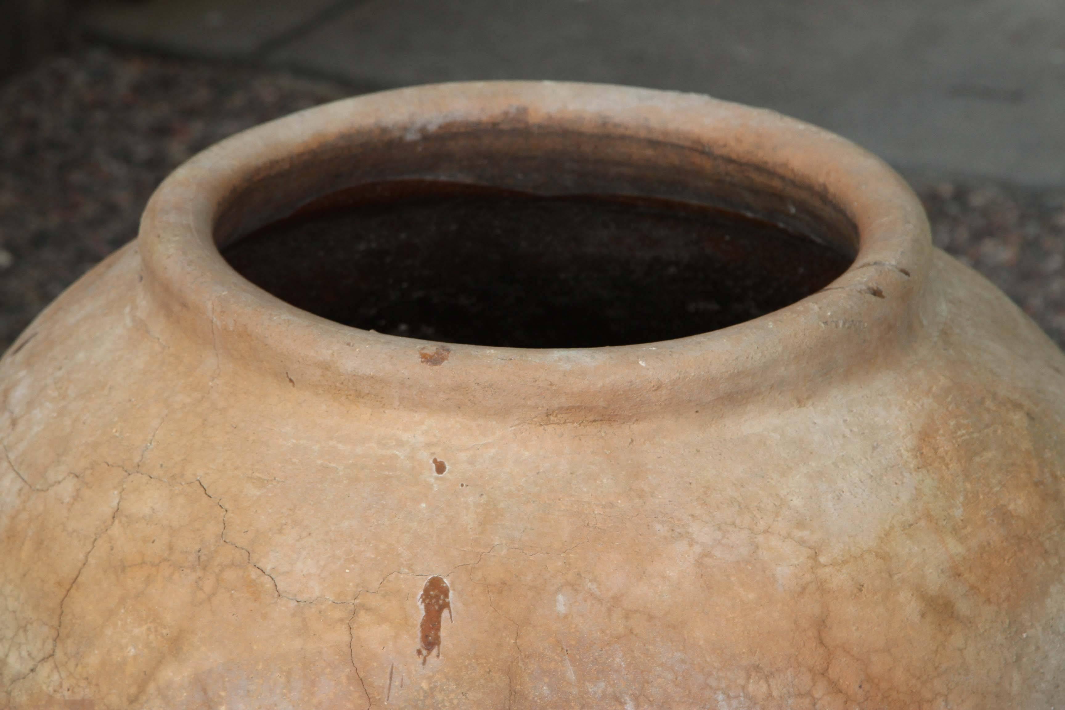 A large 19th century terra cotta pot with good form and patina from Oaxaca Mexico.