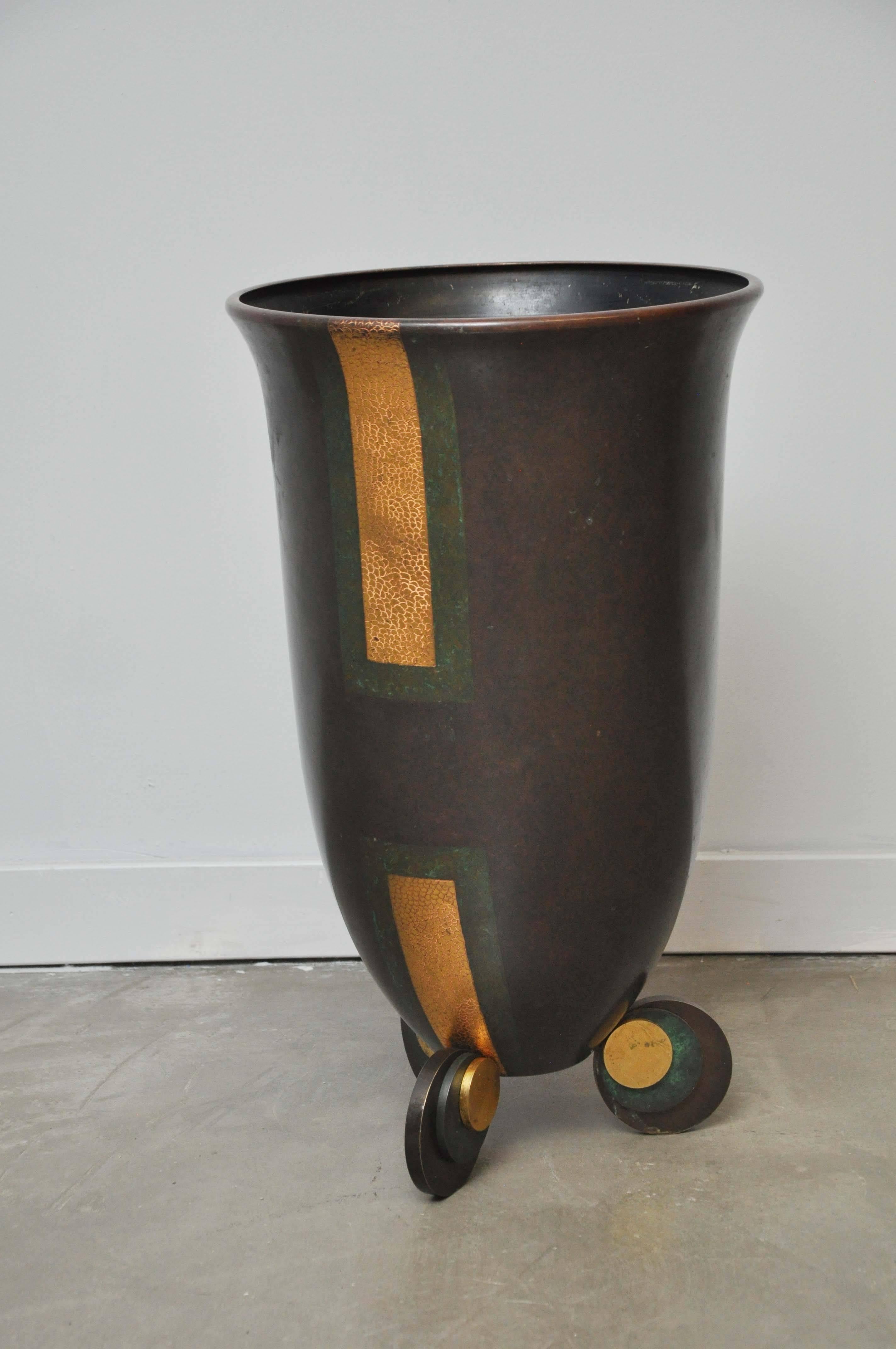 Bronze urn by Karl Springer, circa 1980. Bronze with gilding and applied green patina.

Authentication by Tom Langevin, Director of Karl Springer design, will be included.