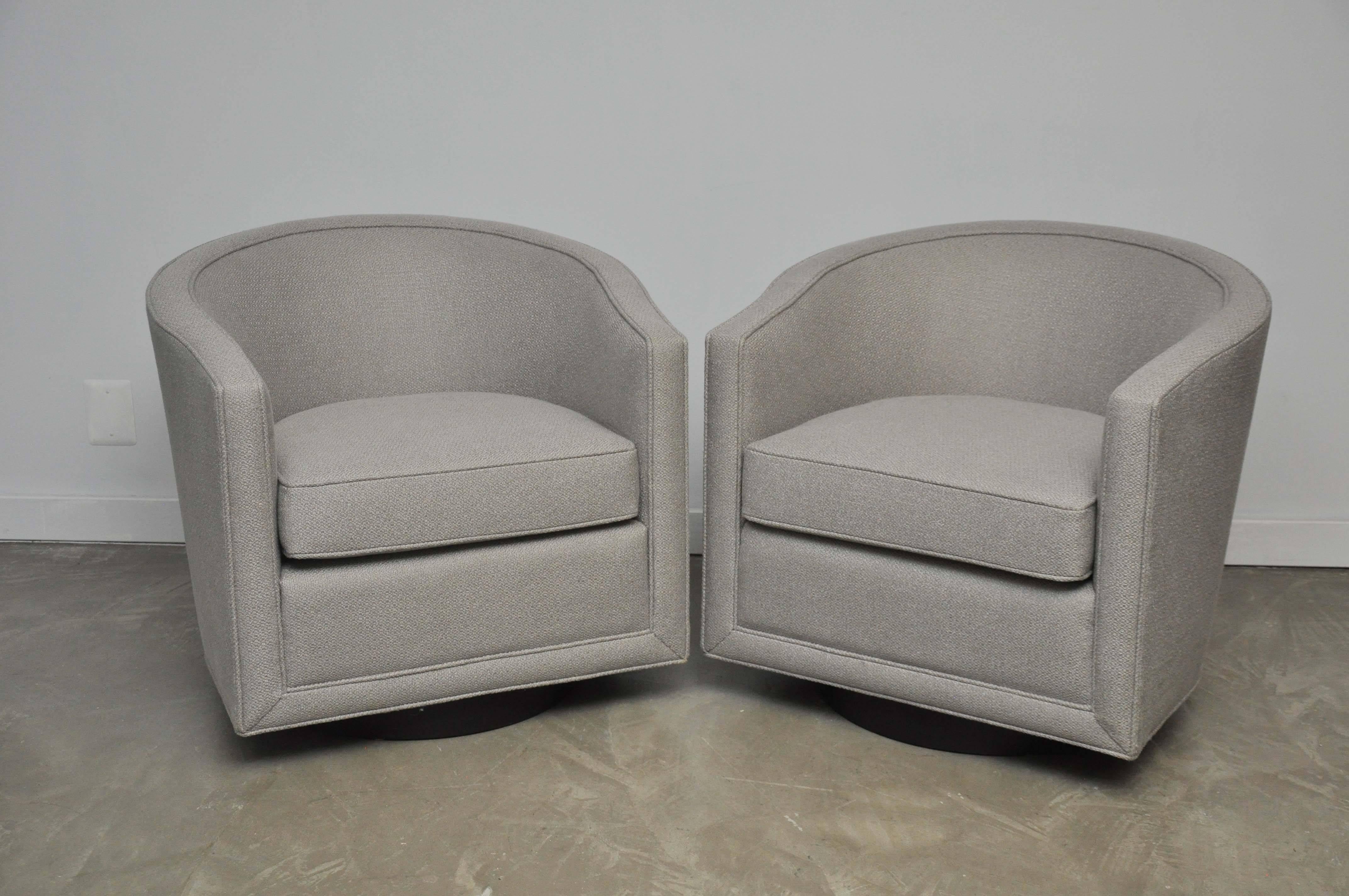Classic pair of swivel lounge chairs by Roger Sprunger for Dunbar. Fully restored. Newly upholstered.
