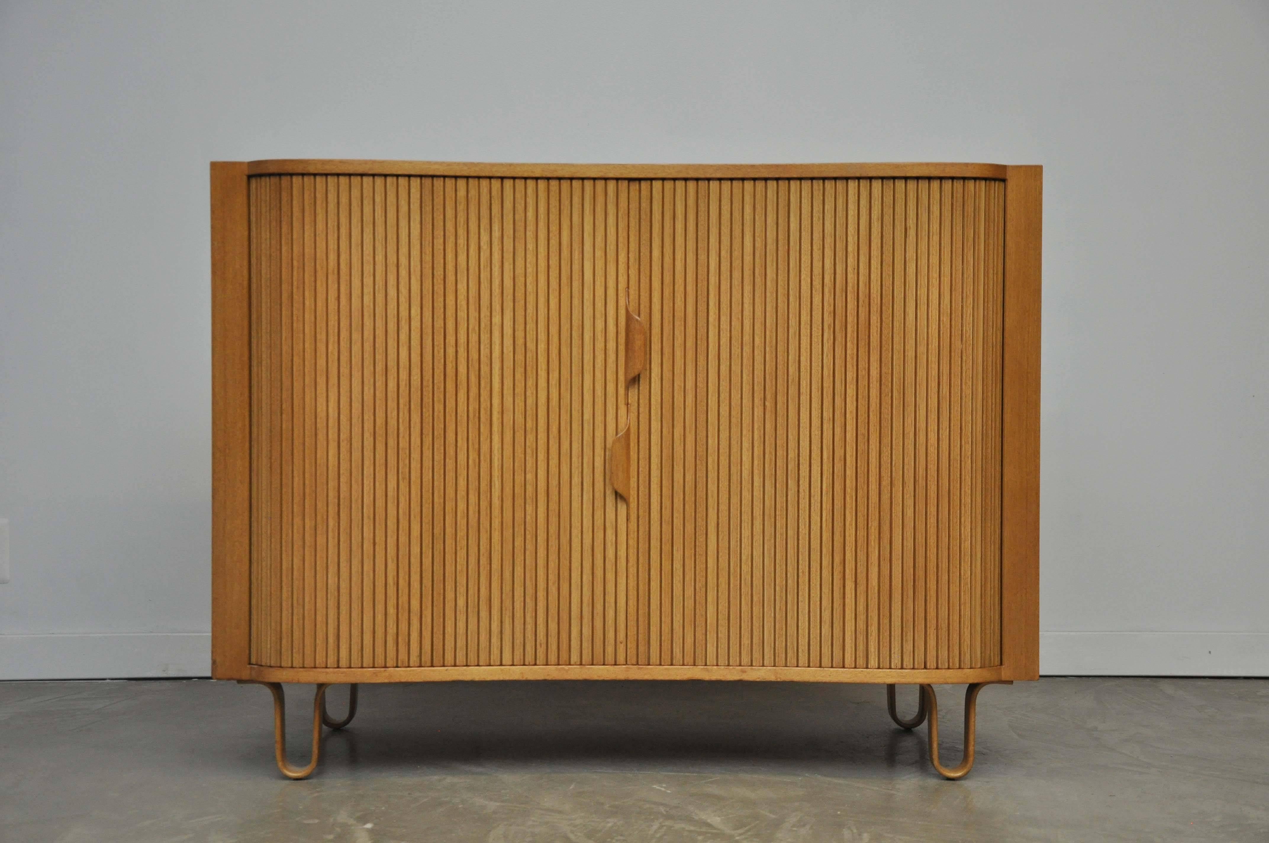 Pair of chests by Edward Wormley for Dunbar. Tambour doors open to reveal many storage drawers. Rare form with bentwood legs, circa 1950.