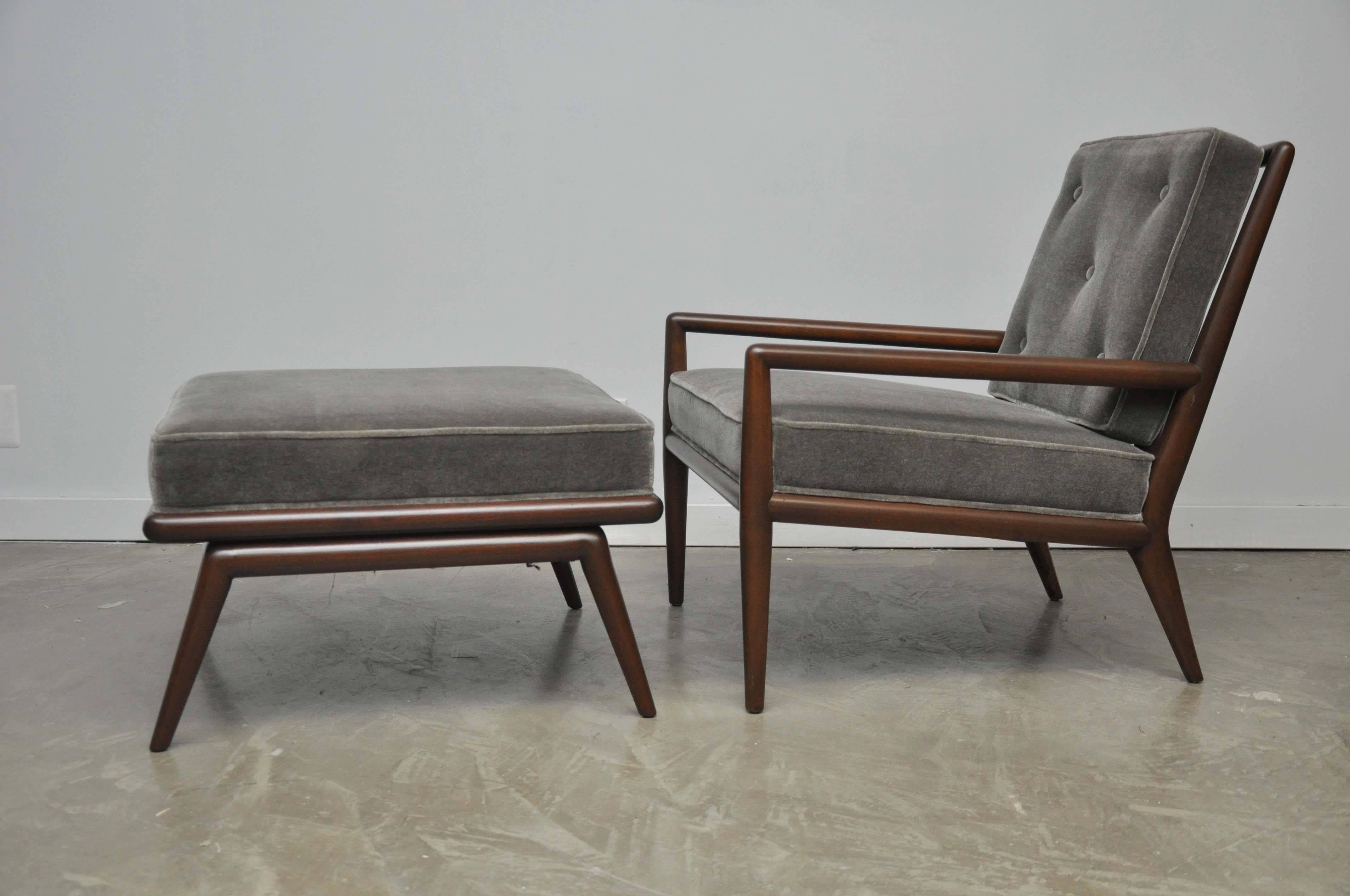 Pair of lounge chairs with ottomans. Designed by T.H. Robsjohn-Gibbings, circa 1950s. Fully restored. Refinished frames with new mohair upholstery.

Chairs 28 wide, 32 deep, 21 tall, 17 seat.
Ottomans 26 x 26, 16 tall.