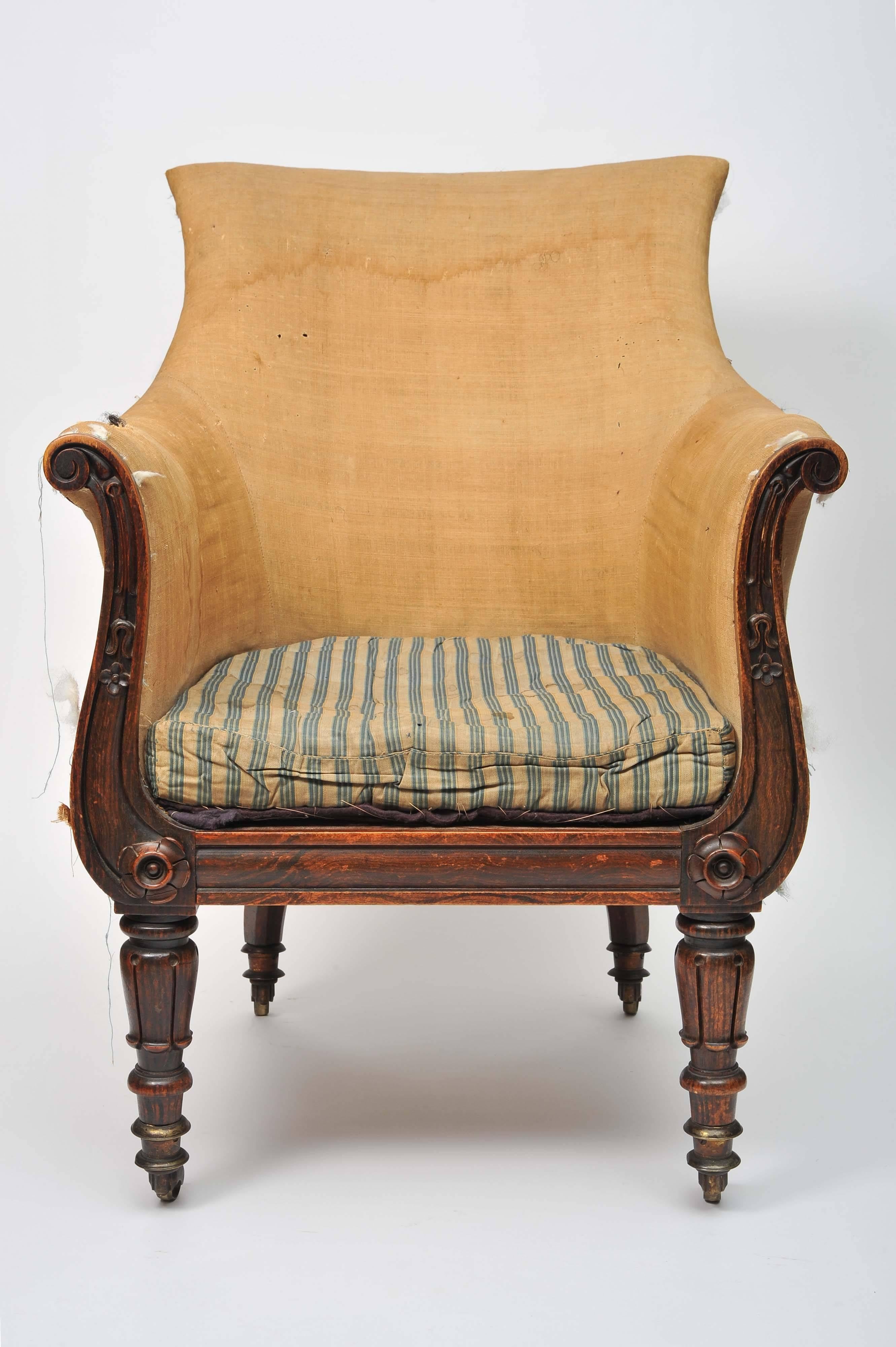 A William IV faux rosewood library bergère chair.