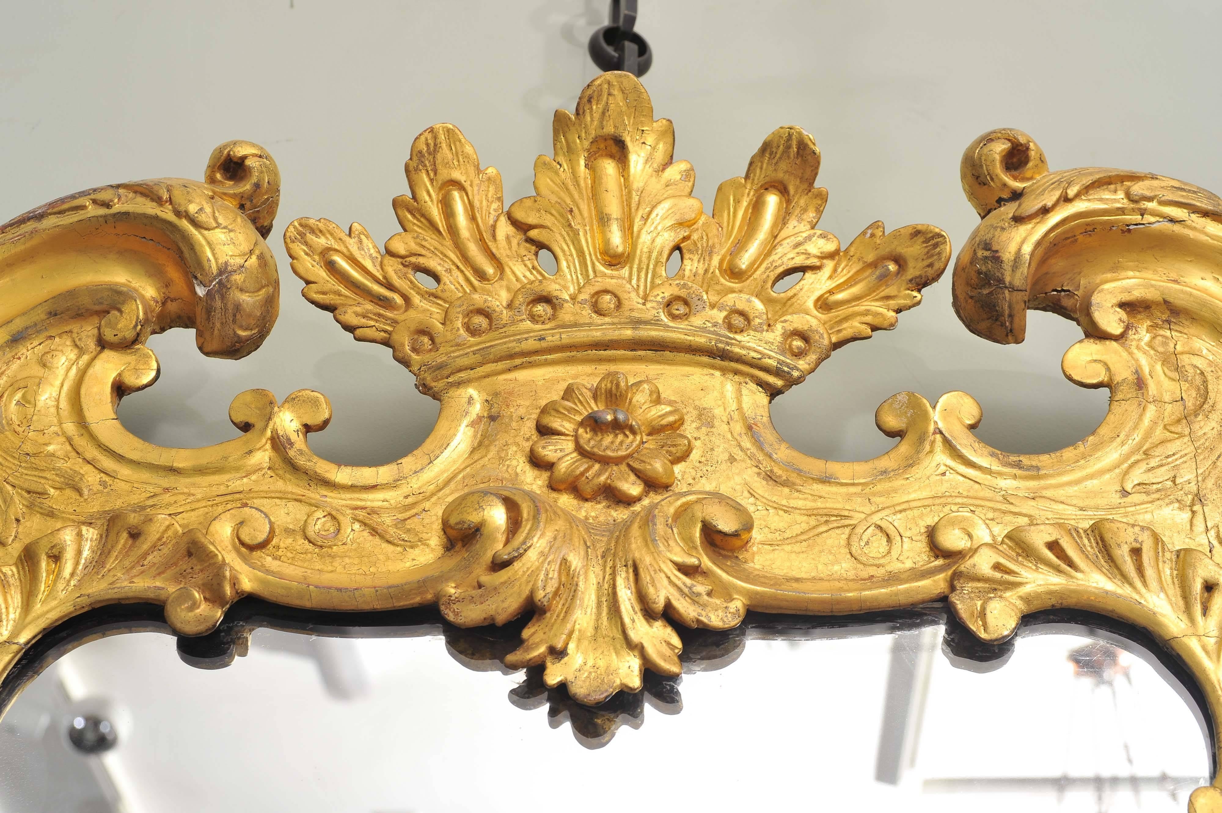 Mid-18th Century Unusual 18th Century Carved Giltwood Wall Mirror For Sale