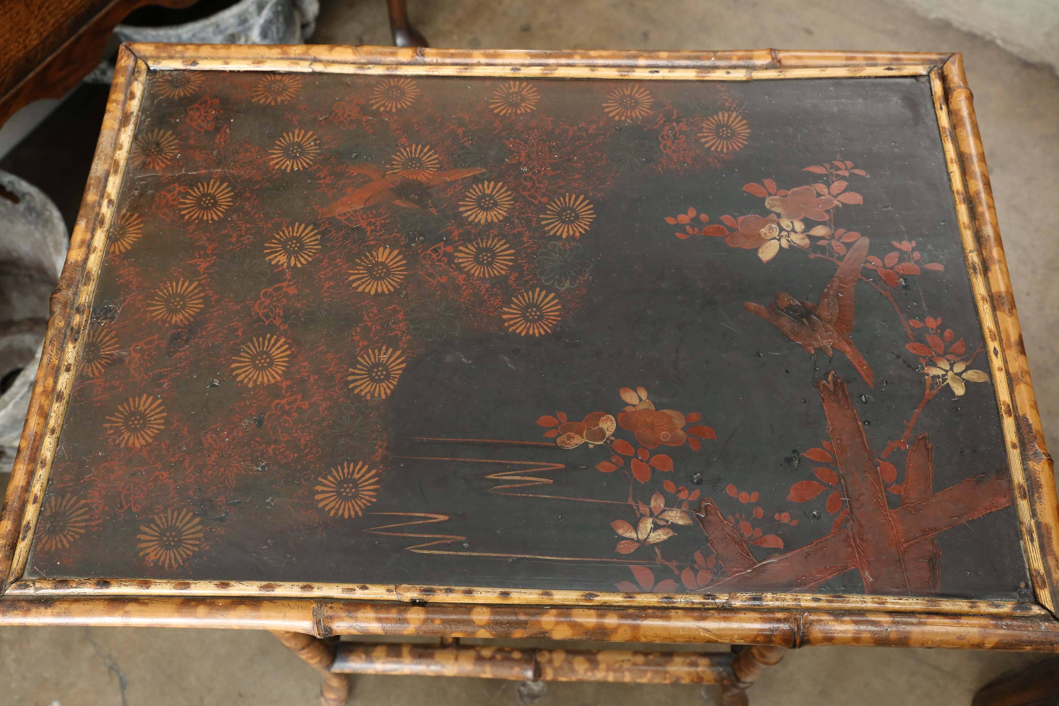 19th century scorched bamboo side table with chinoiserie detail on top. Beautiful structured stretchers.