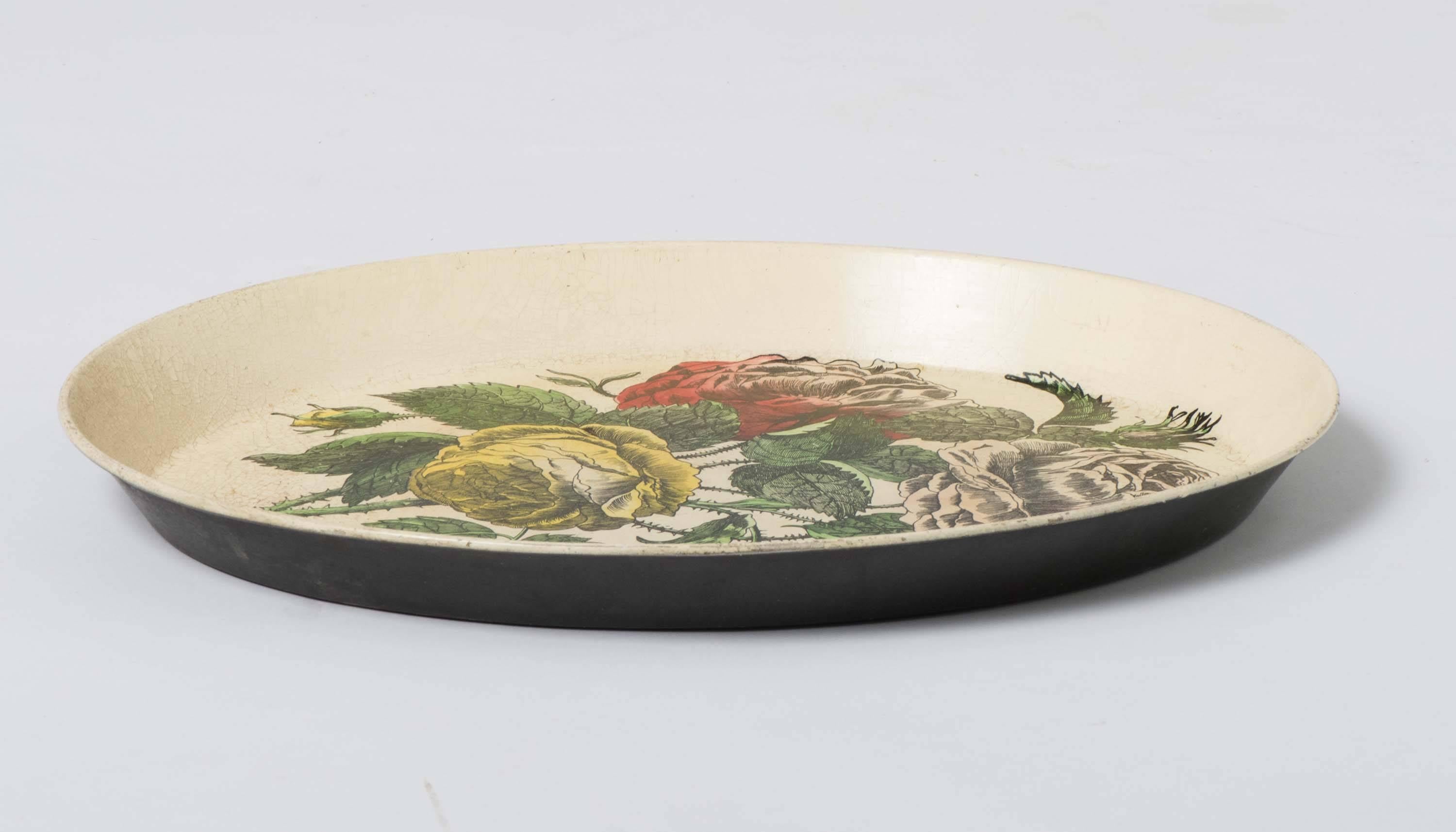 An early Piero Fornasetti oval tray.
“ROSE”
Metal, lithographically printed and hand coloured.
Italy, circa 1950.
Measures: 44.5 cm x 33.5 cm.
 