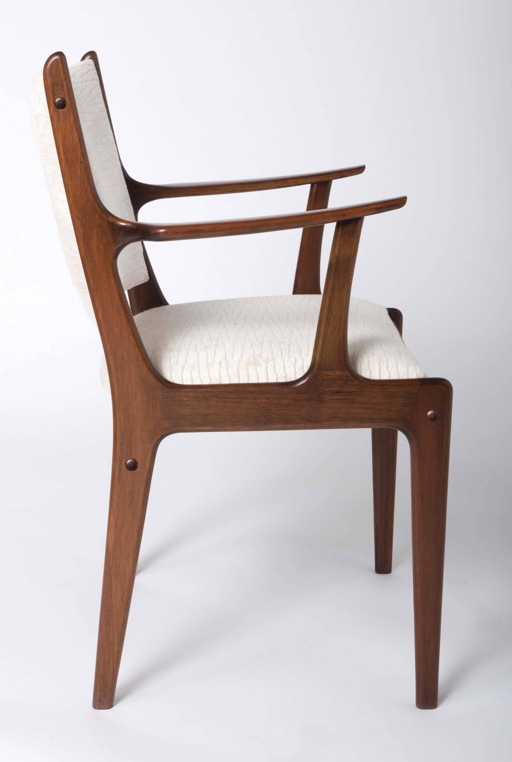A set of twelve Danish rosewood chairs.
Designed by Johannes Andersen for Uldum Møbelfabrik.
Denmark, circa 1960.
Measures: 79 cm high x 46 cm wide x 43 cm deep.
Seat height: 43 cm.
 