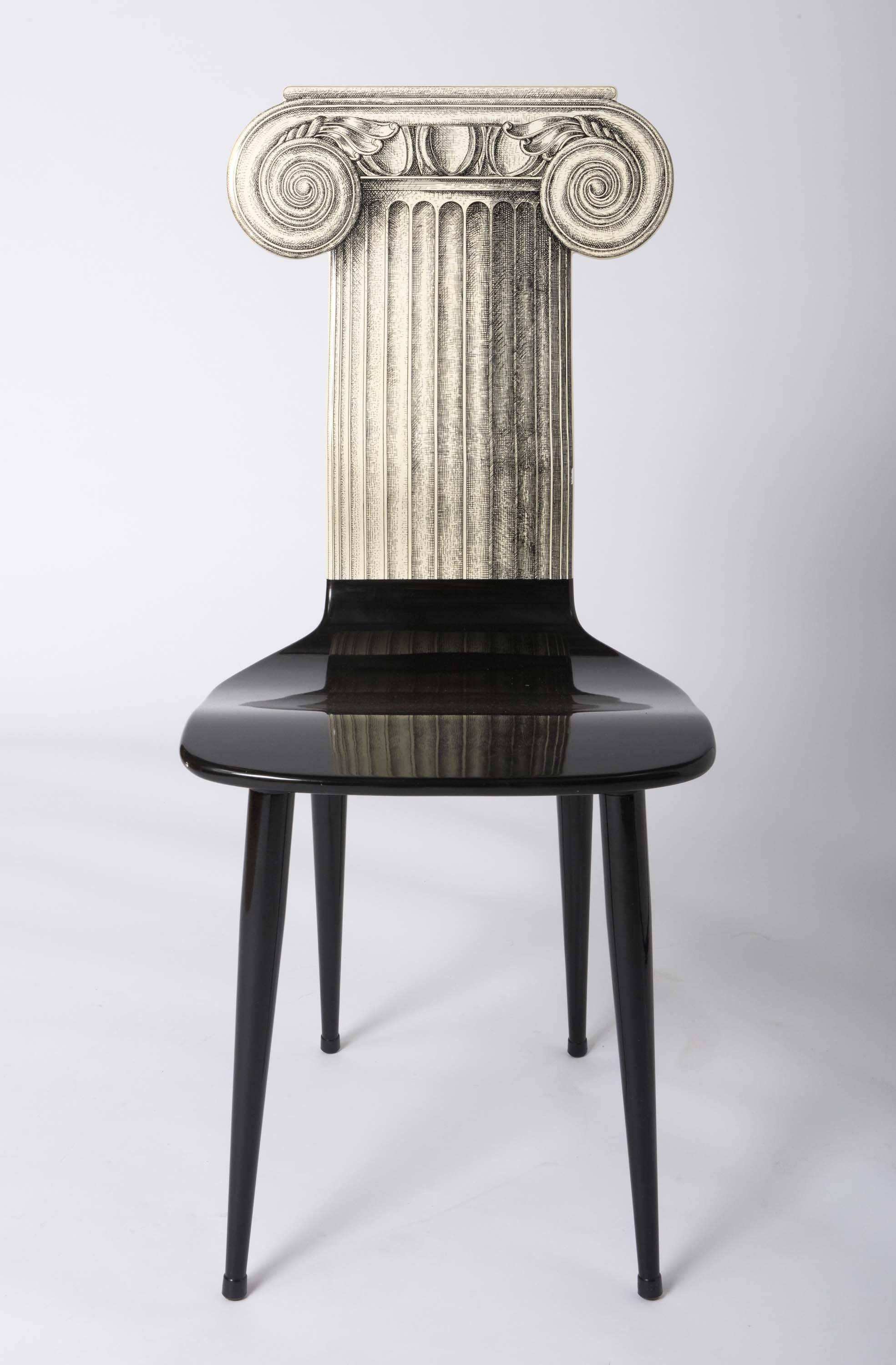 A Piero Fornasetti chair
“Capitello Ionico”
Lithographically printed and hand colored.
Mark to base.
Italy, circa 1970.
Measures: 94 cm high x 41 cm wide x 45 cm deep.
 