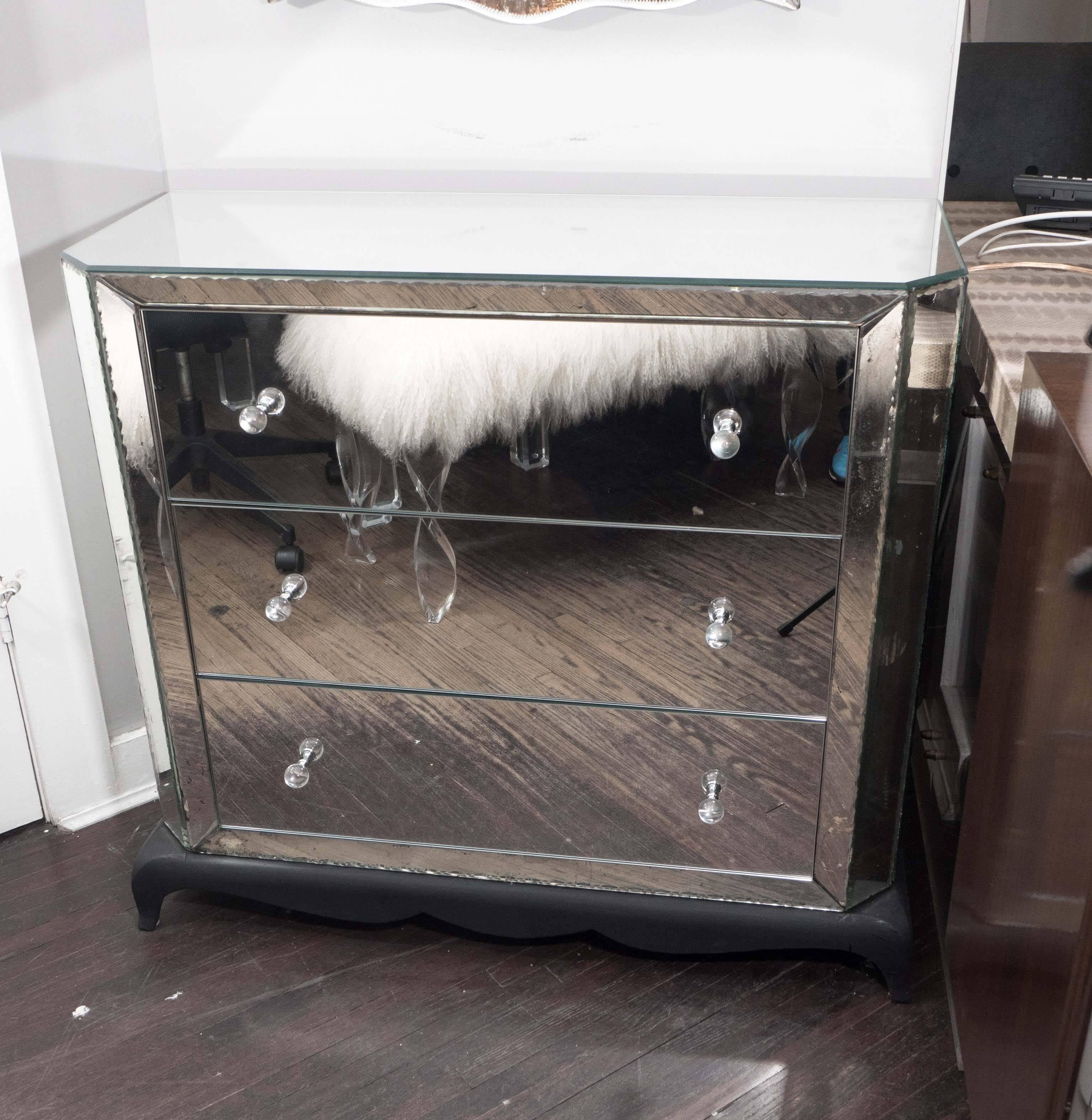 1940s French mirrored dresser with pie crust edges and ebony base.