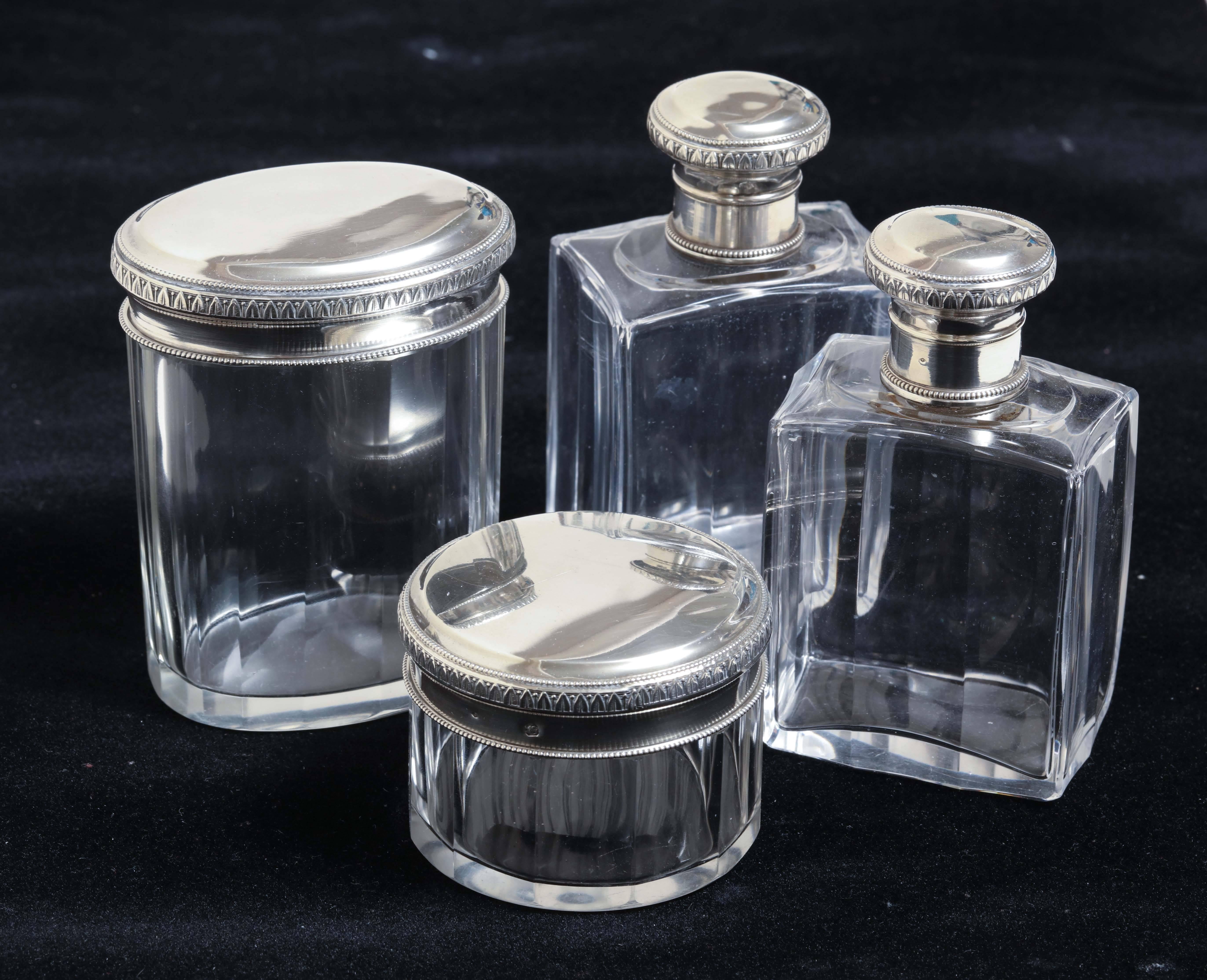 Measures: Circular jar – 2 1/8” high; 2 5/8” diameter.
 Oval Jar – 3 7/8” high; 2 7/8” X 2 ¼”.
 Perfume bottles (2) – 4 1/8” high; 2 3/8” X 1 ½”.

Impressed with Minerve for 950 silver/ unidentified maker’s poincon.

(Price shown is reduced