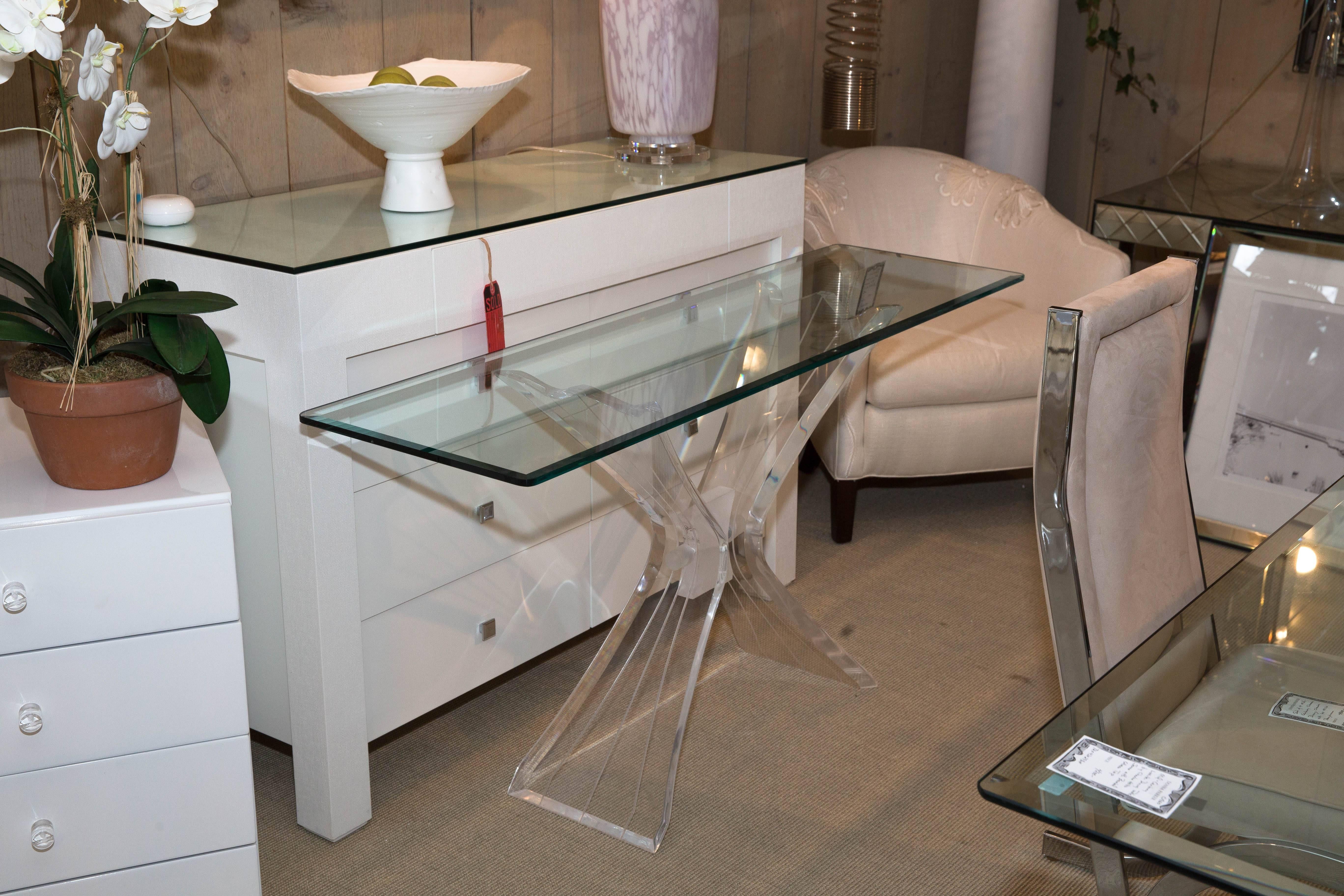 Attractive Mid-Century console with beveled glass top and "butterfly" Lucite base.