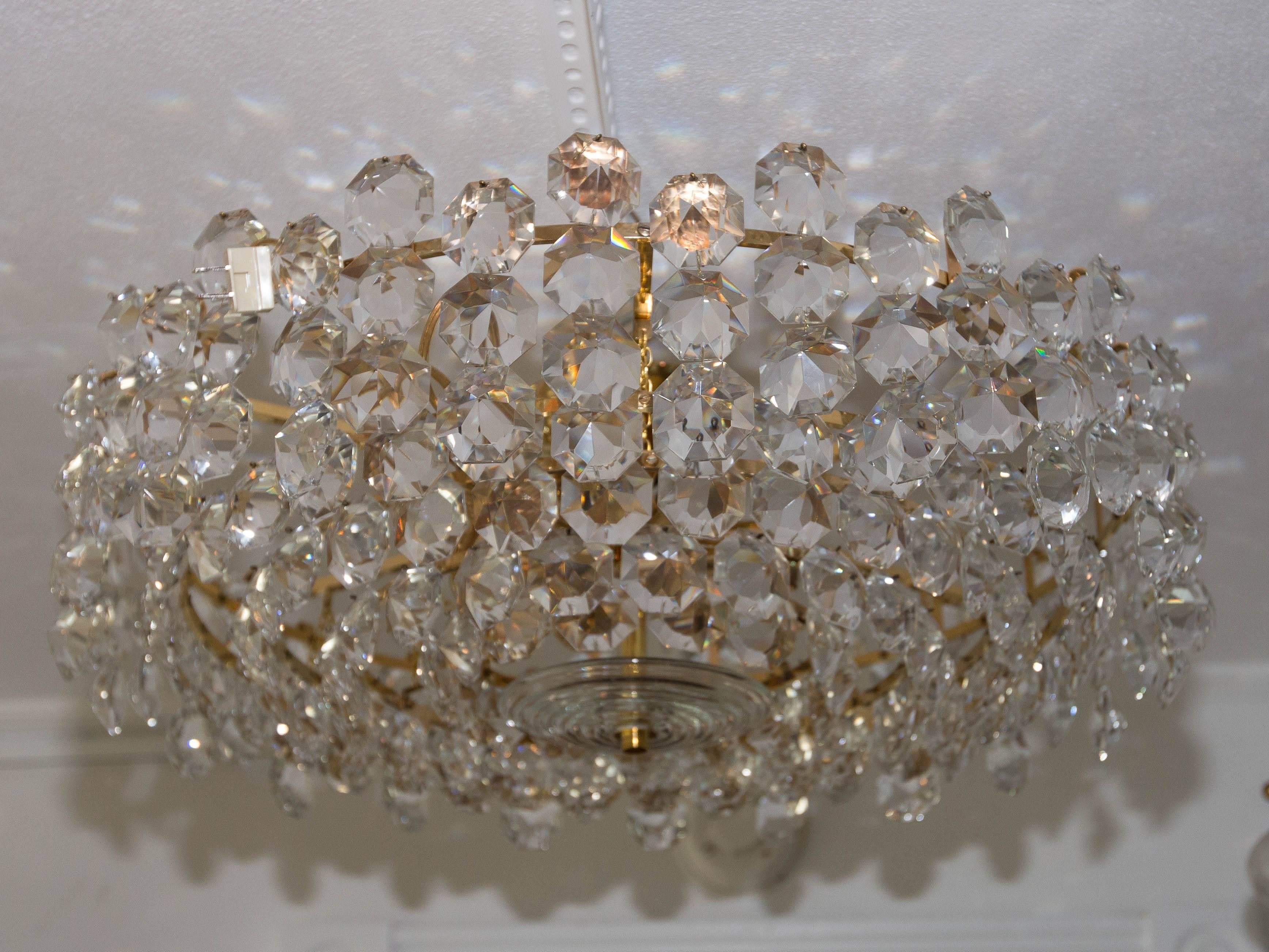 Mid-Century Modern Tiered Brass and Facet Cut-Glass Element Chandelier For Sale