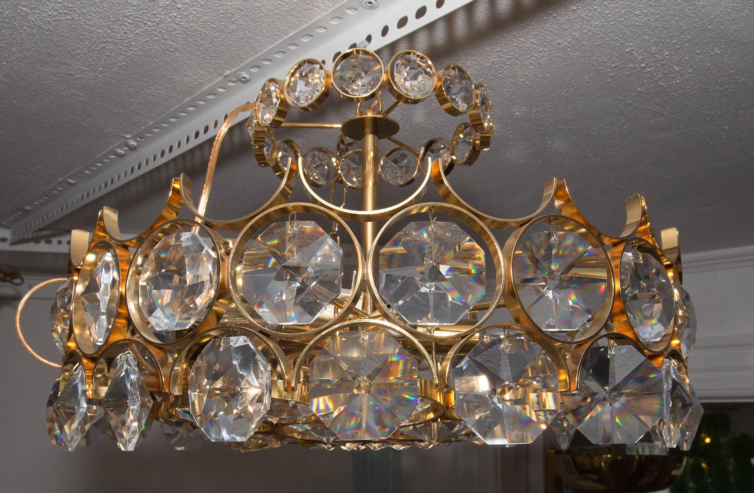 Brass chandelier with facet cut crystal 