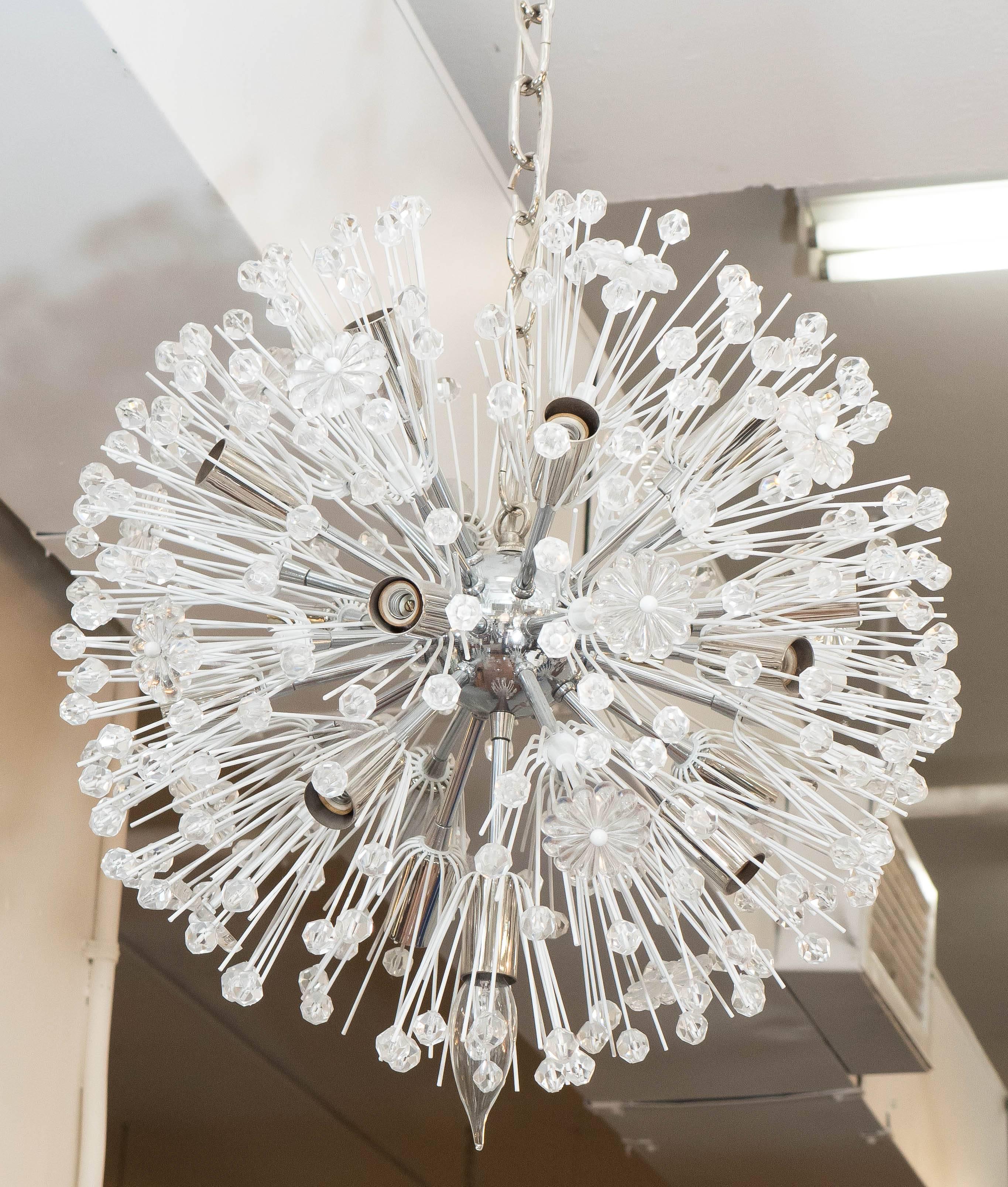 A 'snowball' Sputnik chandelier by Austrian designer Emil Stejnar and produced by Rupert Nikoll circa 1960s, nucleus, arms and socket covers in chrome, surrounded by faceted glass beads and rosettes on white enameled spires. Very good vintage