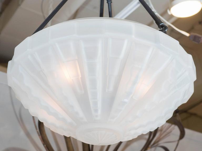 A French vintage pendant light, with frosted glass dish shade, detailed with geometric patterns in the Art Deco mode, suspended by hooked rods to circular canopy. Markings include label [Cvv Vianne - Made in France] along the rim of the shade. Very
