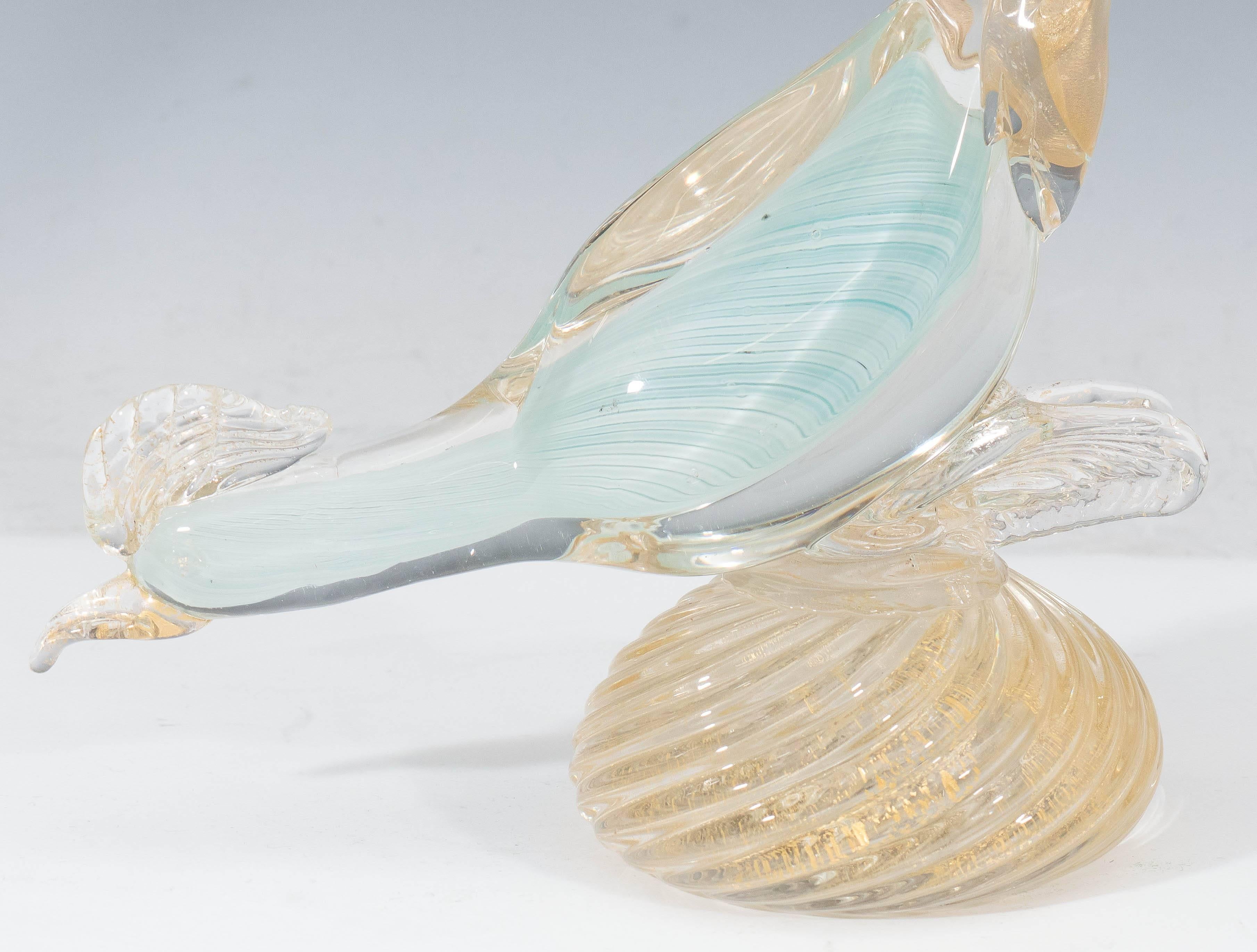 A Venetian sculptural pheasant in handblown glass, produced on the isle of Murano, circa 1950s. The bird comes in pale blue, crest, beak, feathers and gadrooned base decorated with flecks of gold leaf. Markings include original sticker, indicative