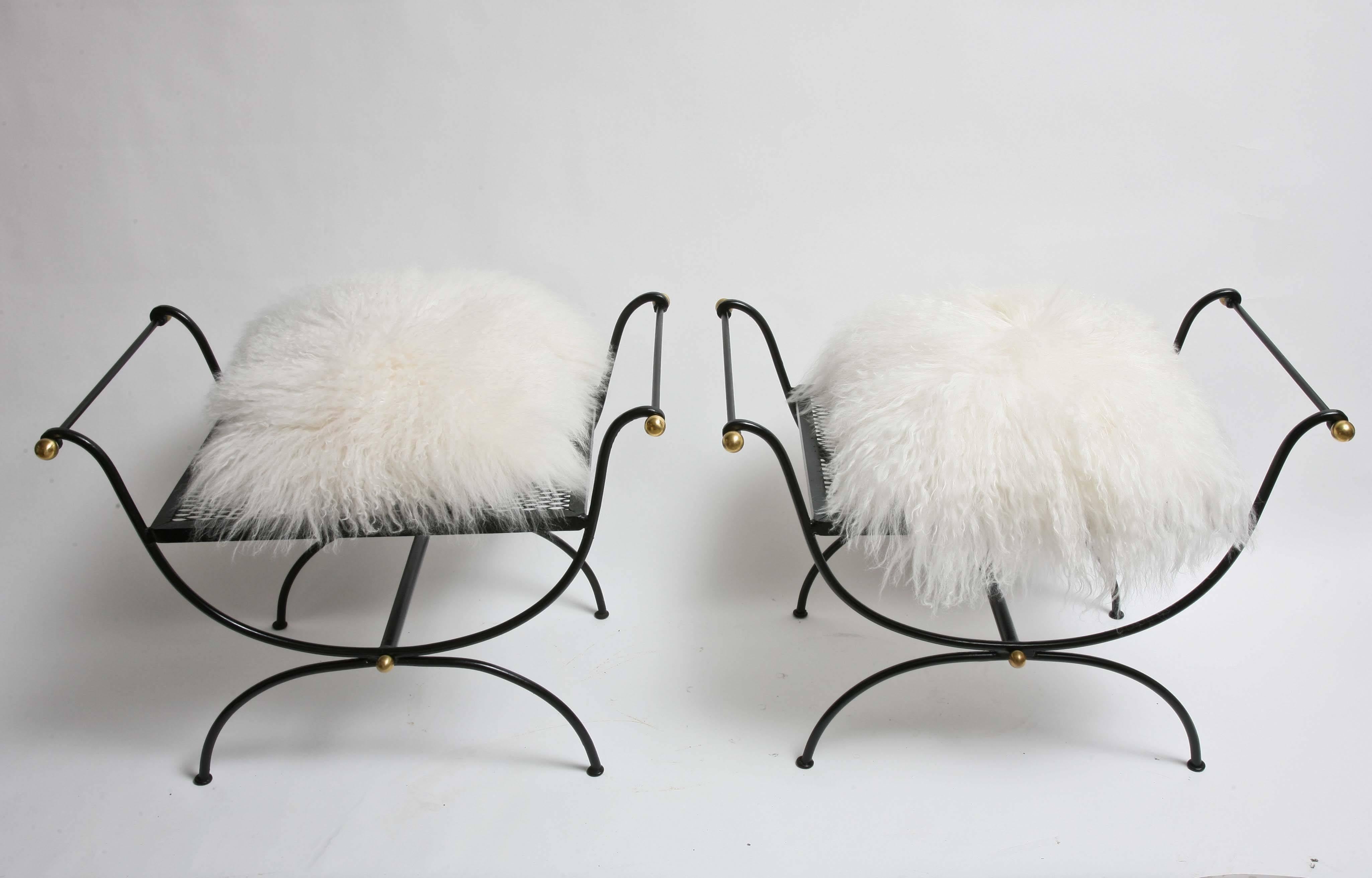 Iron construction with painted black finish and brass accent ball tips. Loose cushions in white long hair real fur.