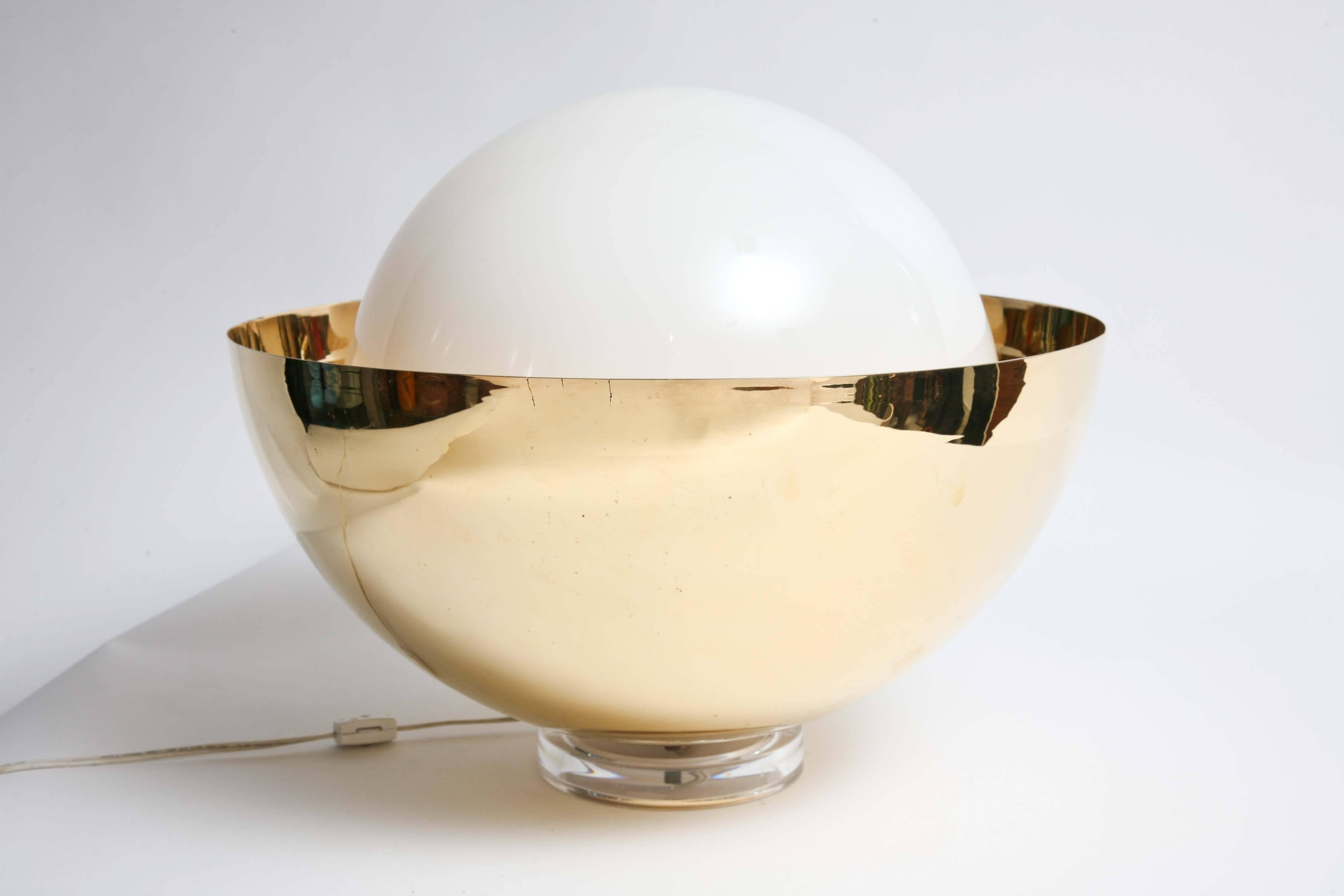 Polished solid brass base with large white glass globe. Acrylic base. Super cool lamp with nice glow. Base is 6