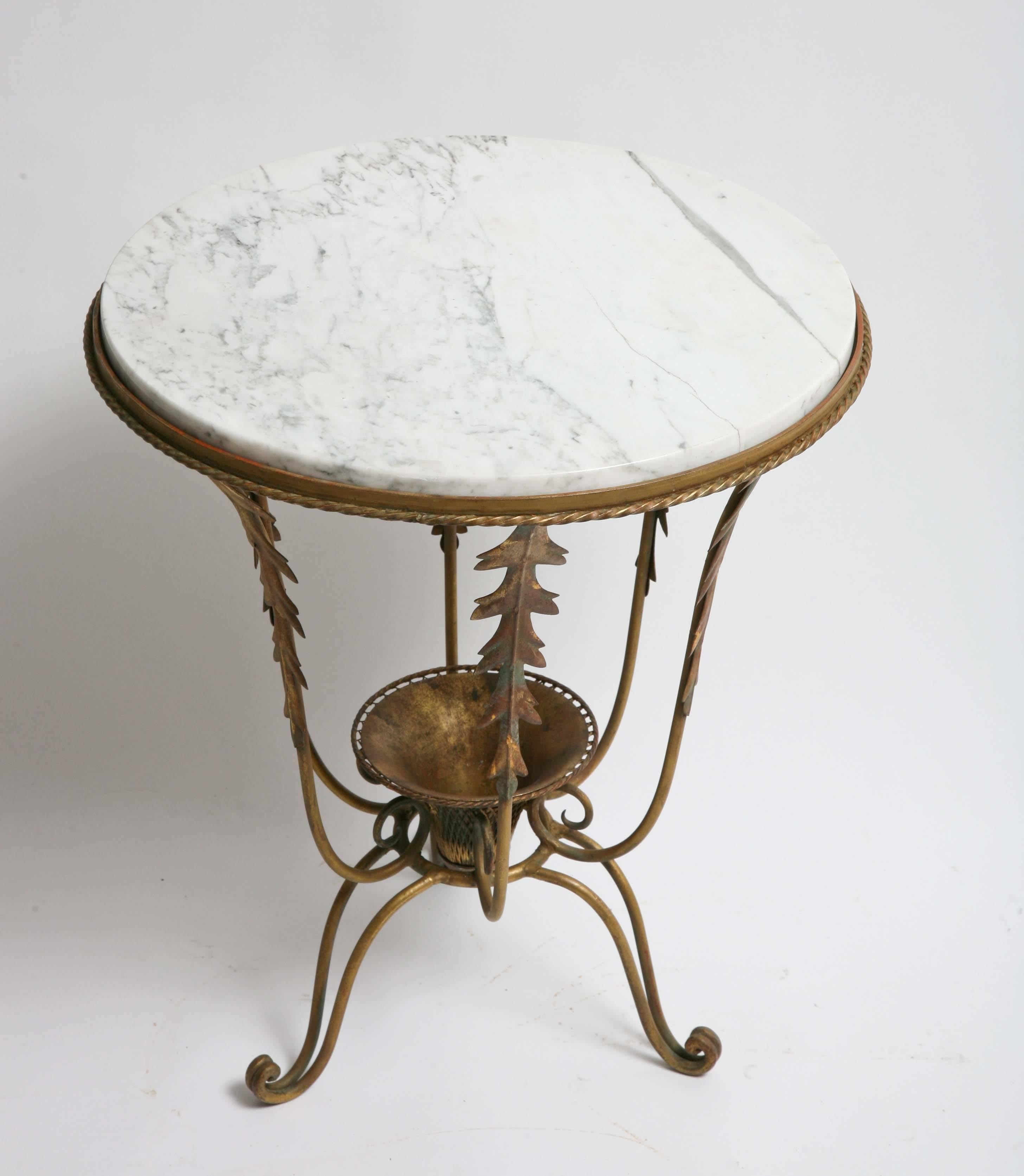Gilded iron construction with marble top. Sold in as found condition.