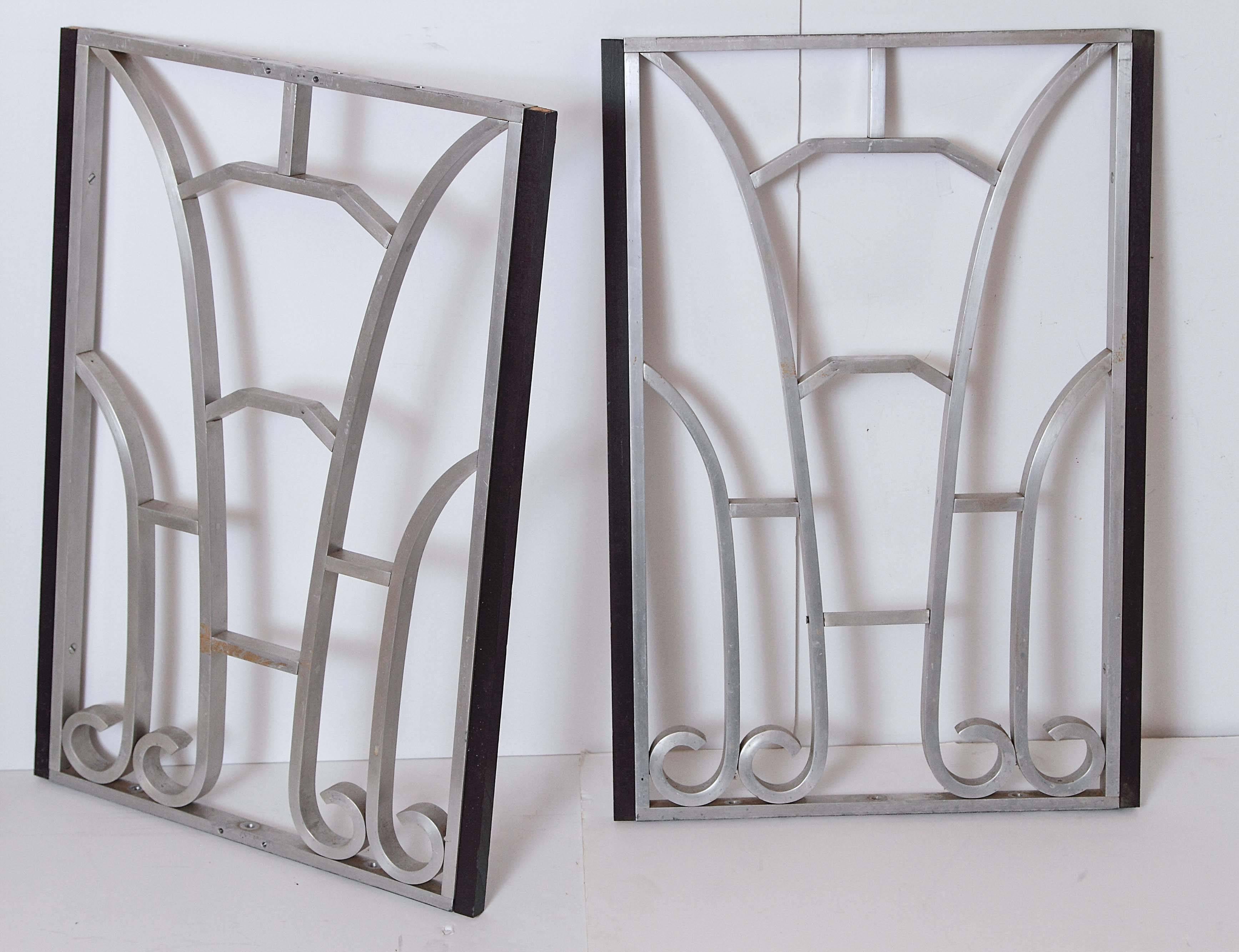 Some very good workmanship on these book-matched panels.
Surprisingly substantial in weight.
Solid machined-aluminum throughout, with attached lacquered-wood side trim.

Could be mounted in any configuration as-is, or backed with stained glass,