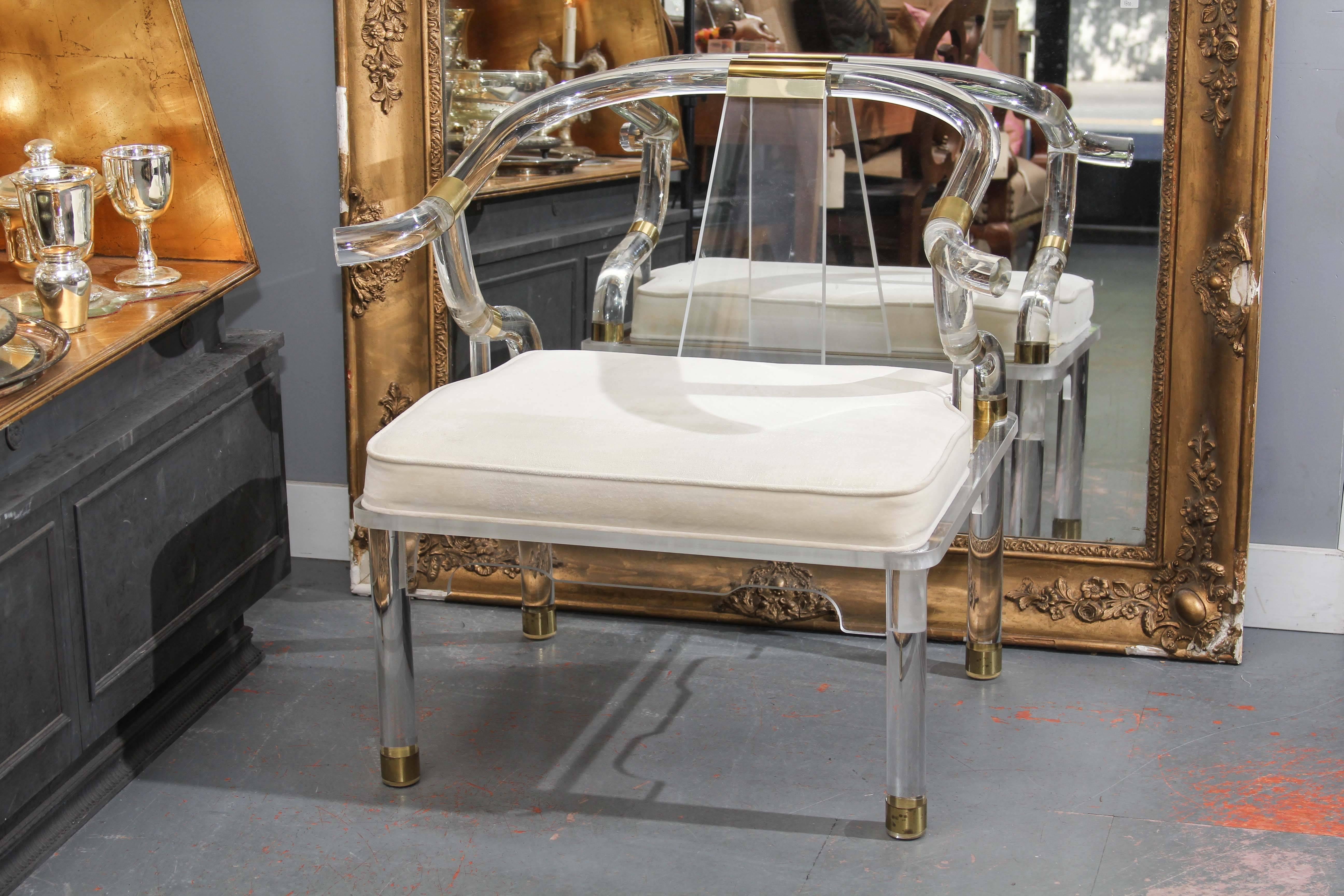 Very nice Lucite and brass trim armchair.