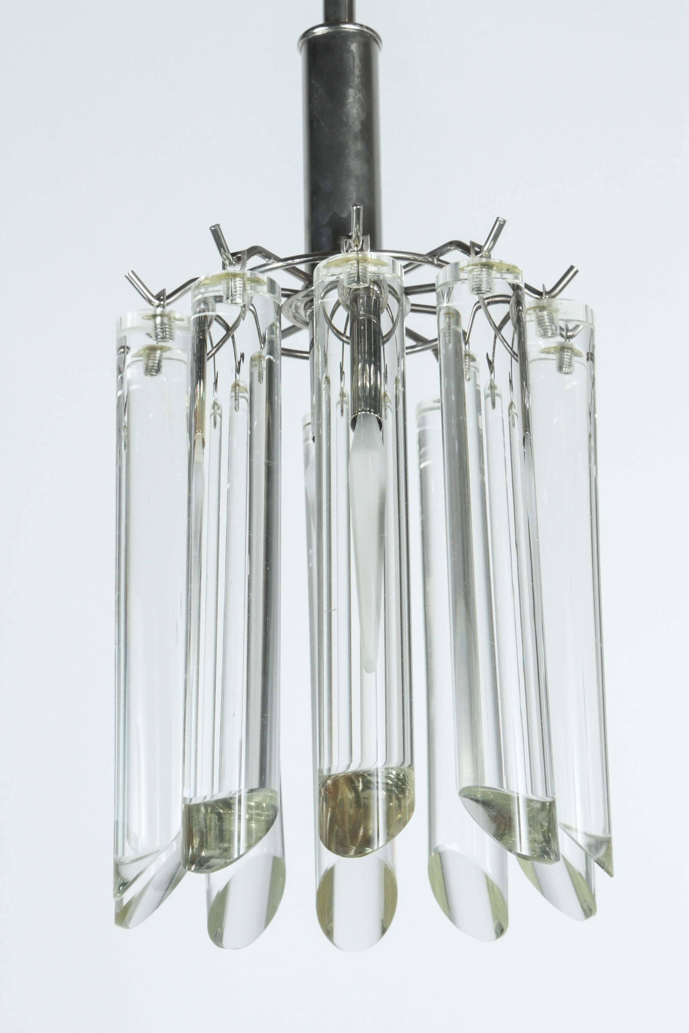 Petit cylindrical pendant light.
The polished chrome armature supports the cylindrical glass elements which are 
illuminated by a single light source.
The fixture comes complete with a matching chrome ceiling canopy.