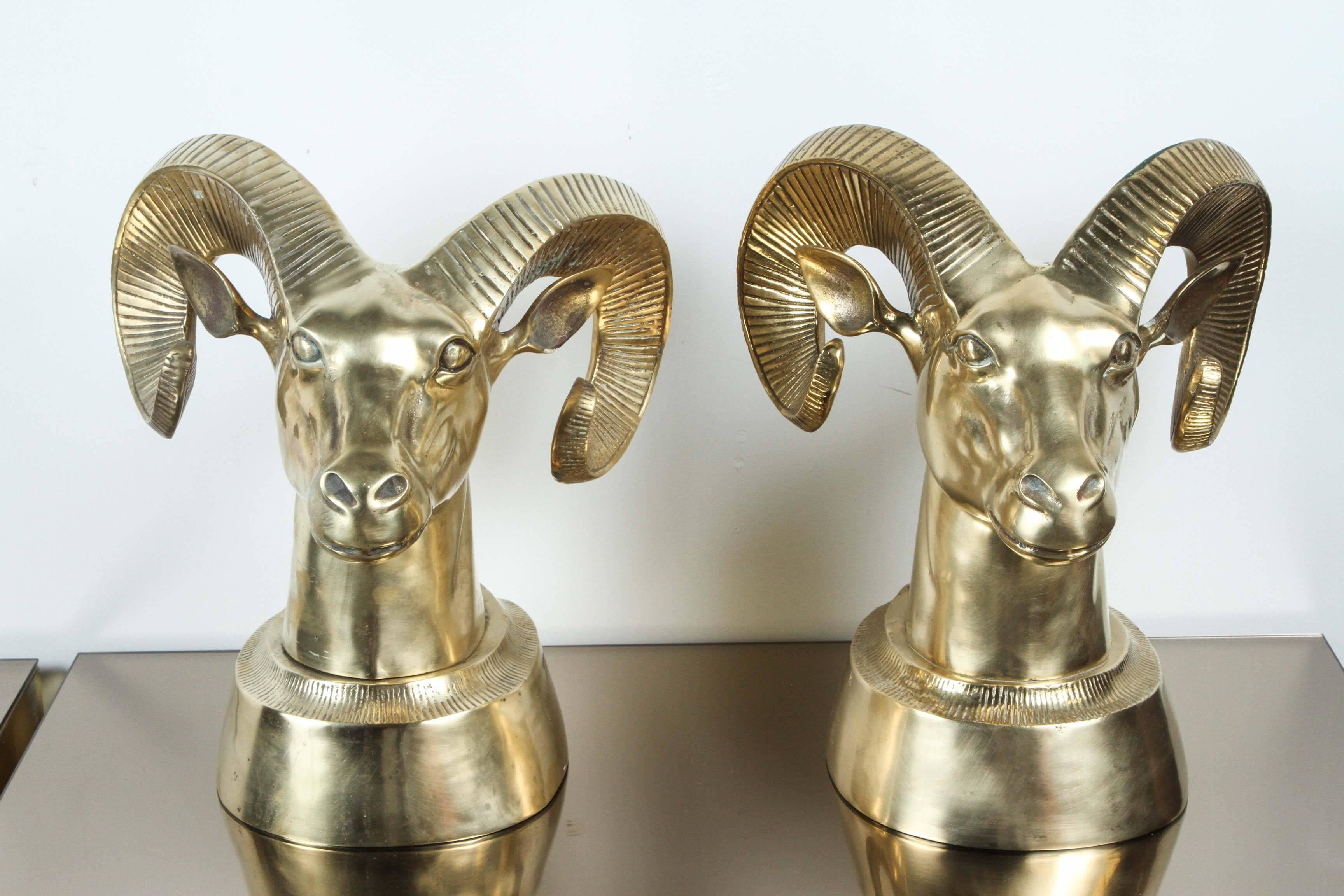 Pair of large decorative brass rams heads in the Hollywood Regency style which are perfect for bookends.
The brass has a slight patina as they were recently polished and one retains,
a green tint behind the horn, but this does not detract from