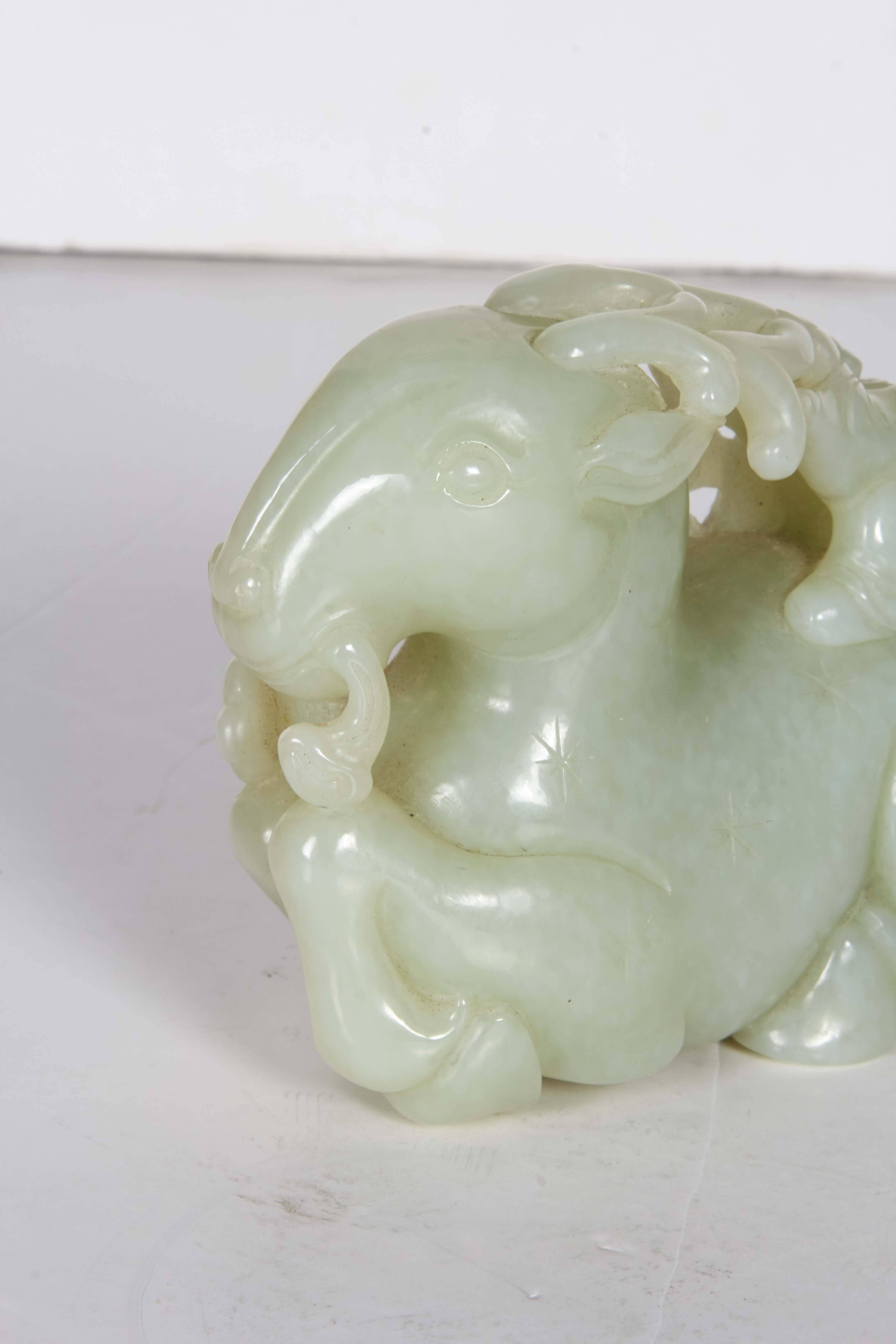 A beautiful Chinese whitish Celadon jade group of a Ram and two boys, beautifully hand-carved and polished, Chinese jade of very high quality, late 1800s, China, Qing dynasty. 
Rams symbolize filial piety, the most important of Chinese virtues,