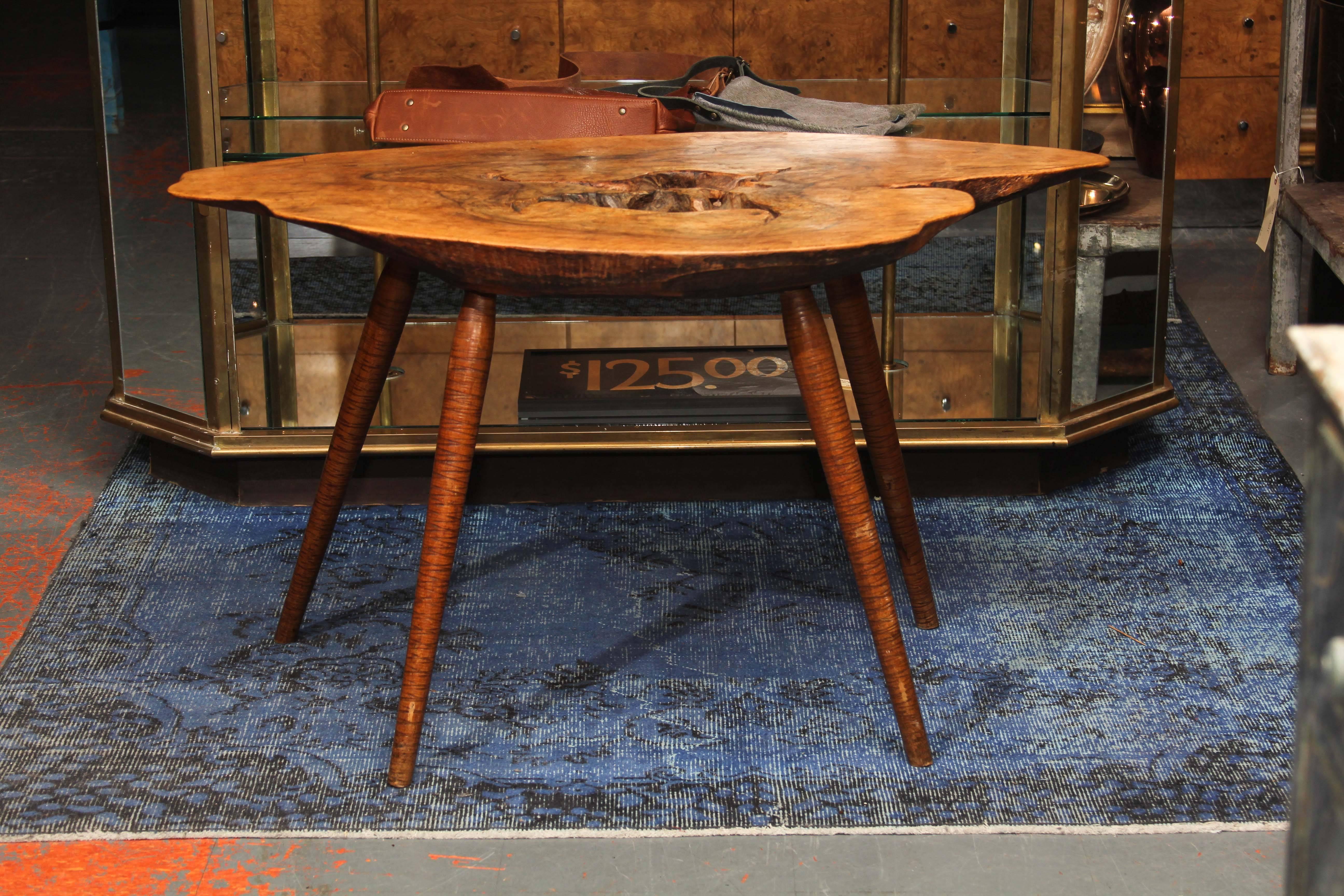 Beautiful natural top with simple splayed legs that have fine circular rings carved into them. Mid-Century, French, great lines, lovely patina.