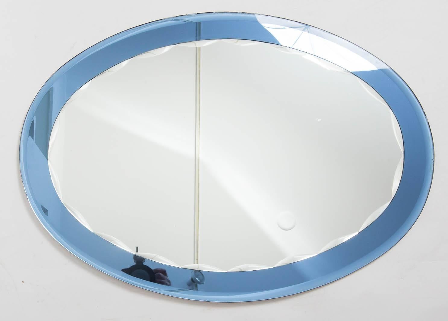Glass Italian mirror, blue is deeper in person.