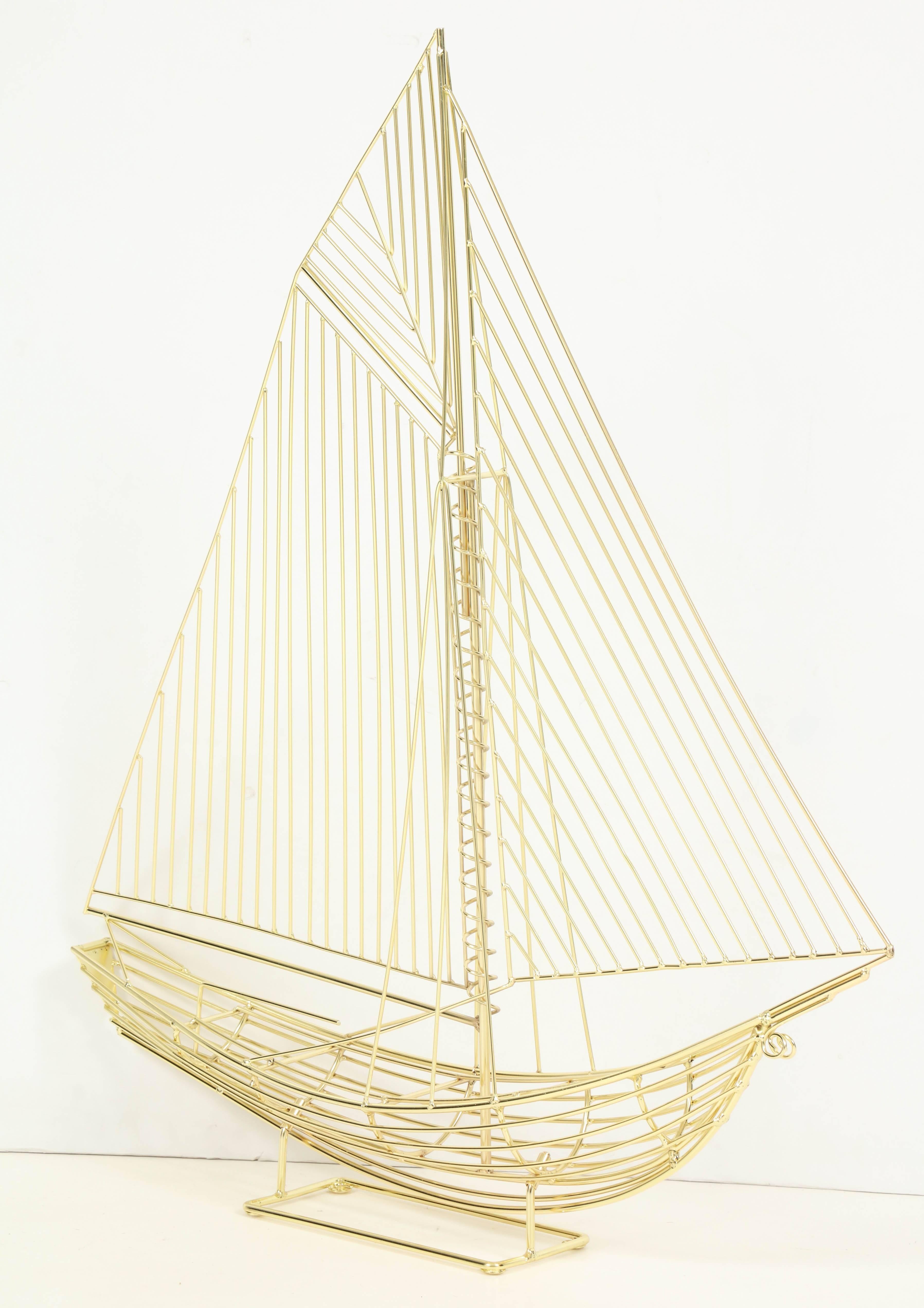 Curtis Jere boat or ship sculpture, signed, circa 1970. Newly professionally re-plated in brass. Original C. Jere label still attached. This sculpture is on display at the Gallery at 200 Lex at the New York Design Center.