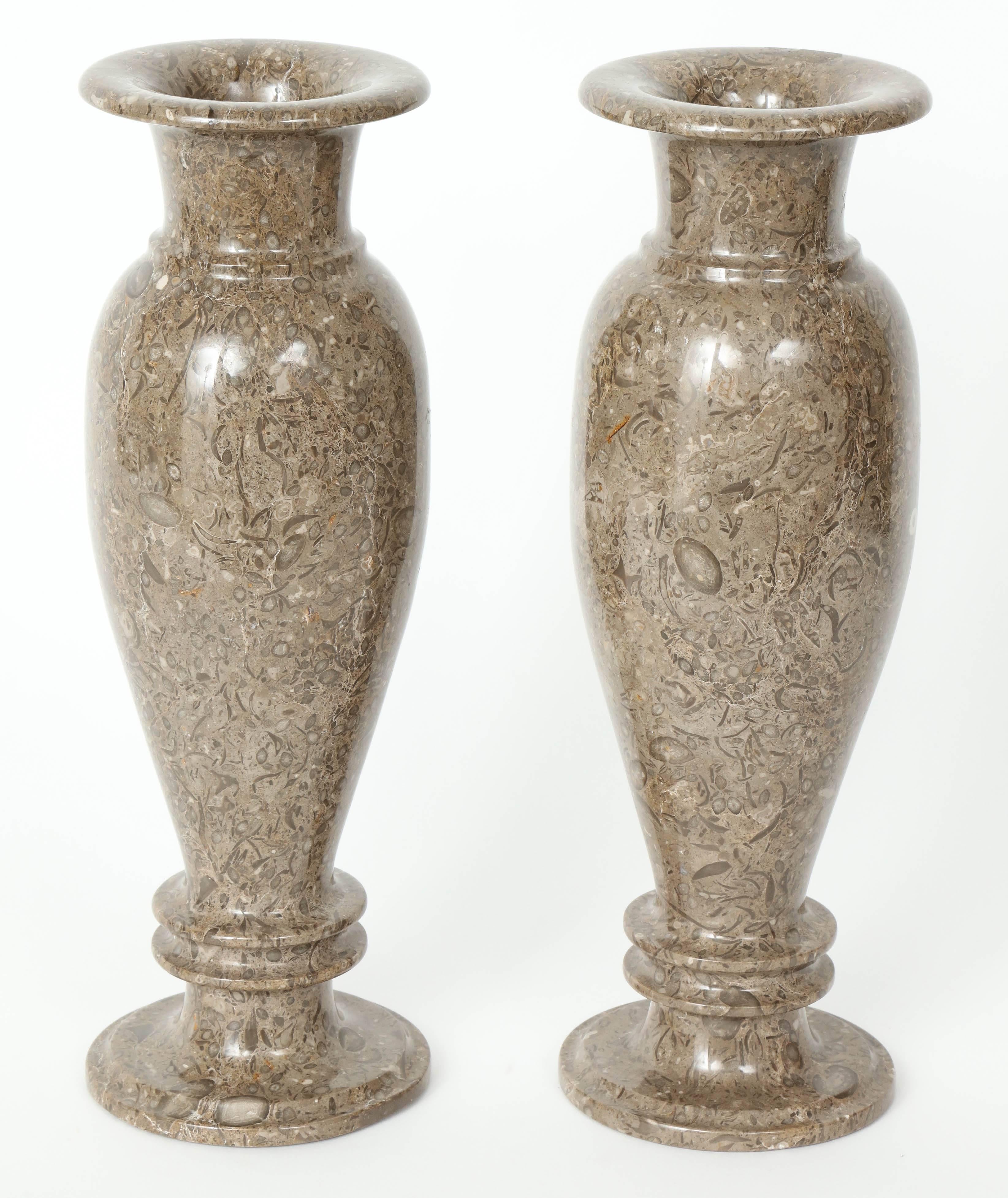 A pair of beautifully figured Gotland limestone vases, circa 1920-1930, from the Swedish Island of Gotland.

Excellent condition with a minor old repair to one base. 

