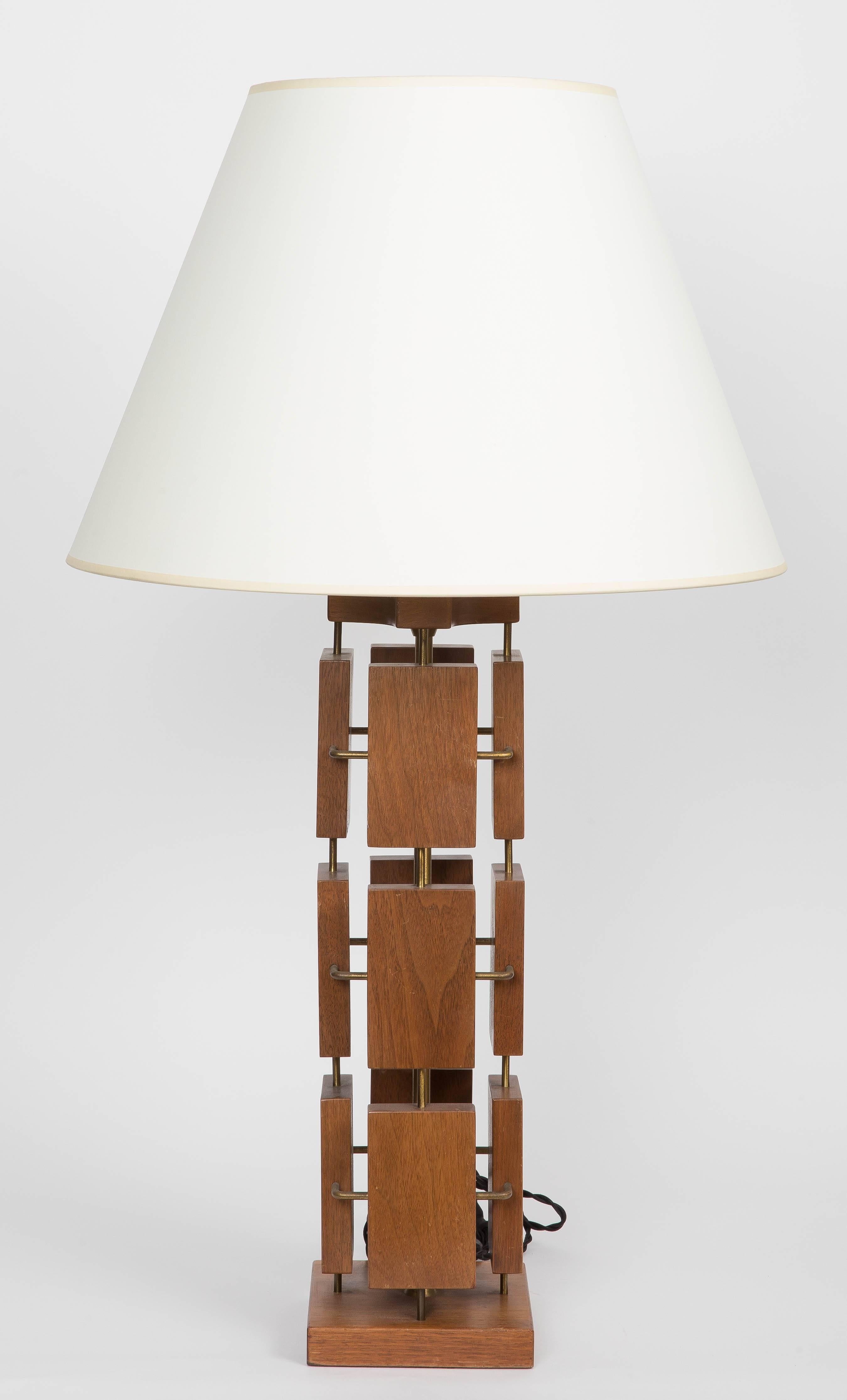 Modernist table lamp made with brass and mahogany.